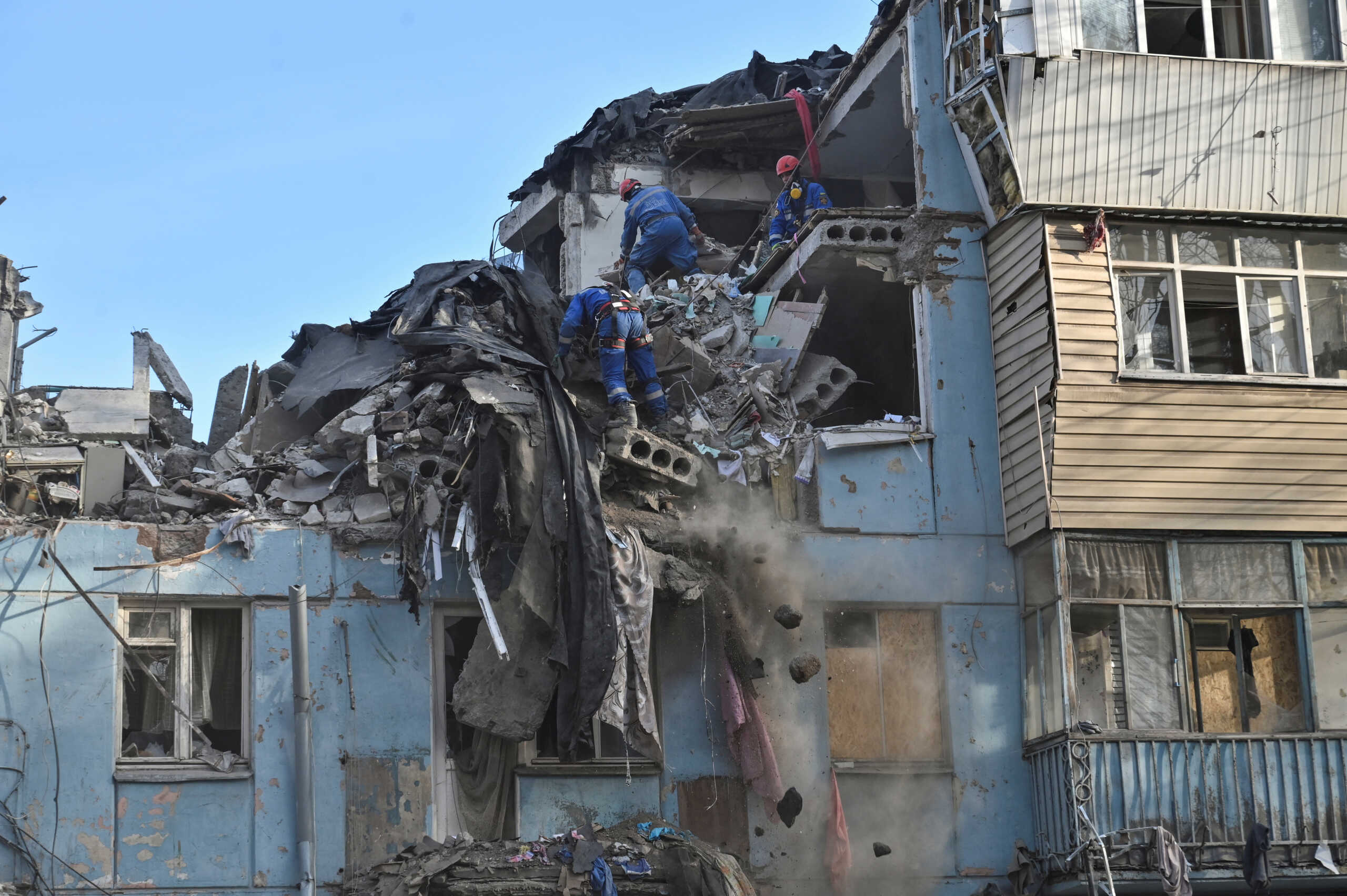 Rescuers work at a site of a residential building heavily damaged by a recent Russian missile strike, amid Russia's attack on Ukraine, in Zaporizhzhia, Ukraine March 4, 2023. REUTERS
