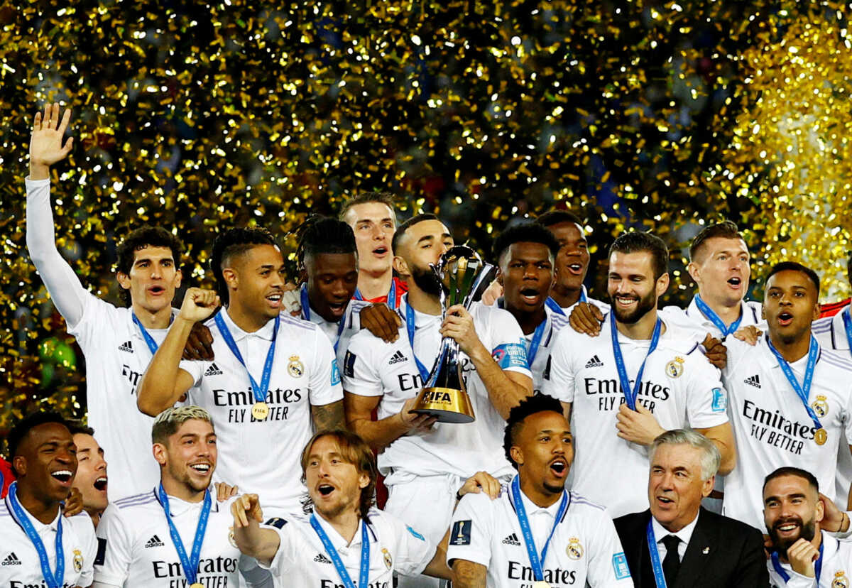 FILE PHOTO: Soccer Football - FIFA Club World Cup - Final - Real Madrid v Al Hilal - Prince Moulay Abdellah Stadium, Rabat, Morocco - February 11, 2023  Real Madrid's Karim Benzema kisses the trophy and celebrates with teammates and coach Carlo Ancelotti after winning the FIFA Club World Cup final REUTERS