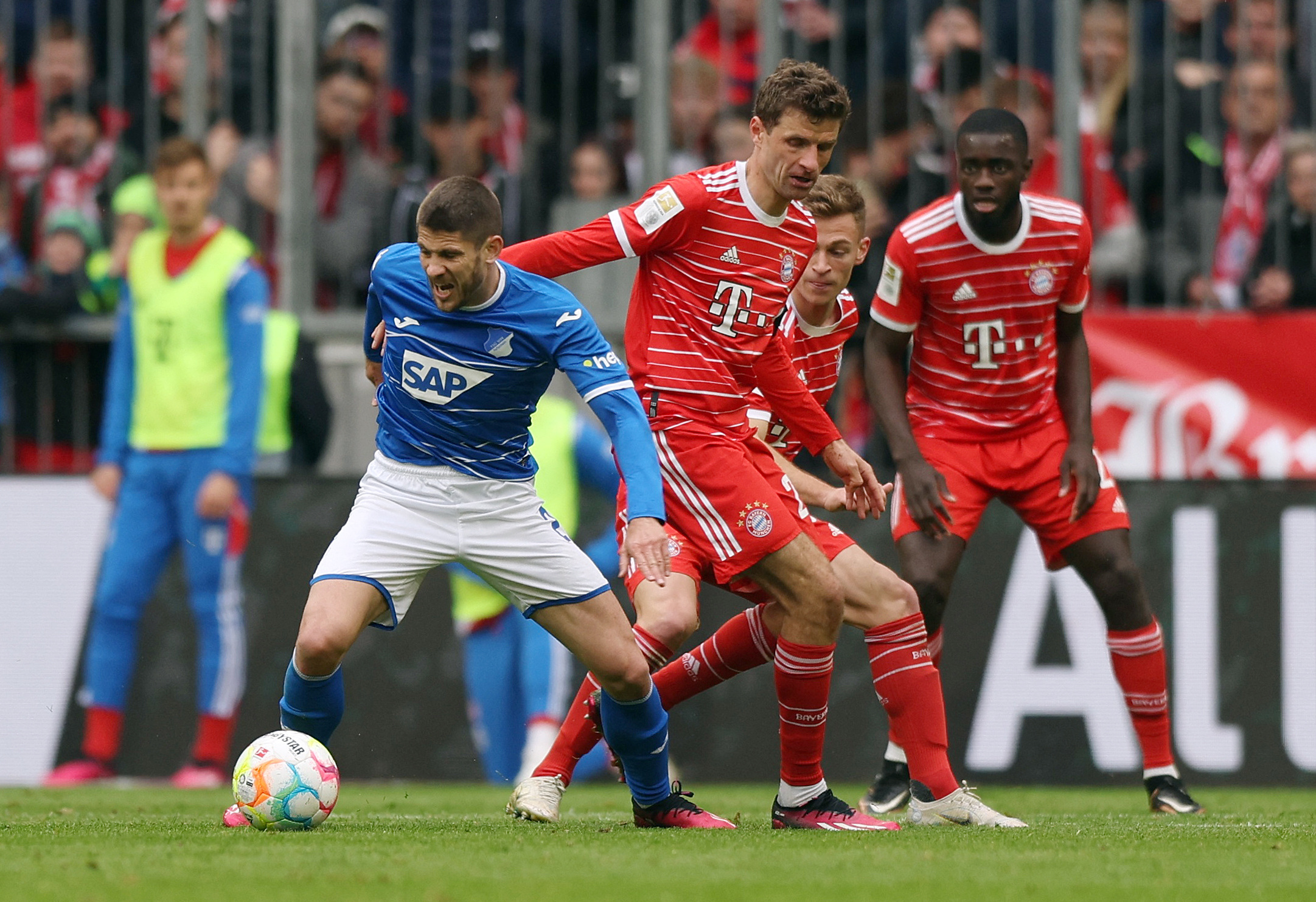 Soccer Football - Bundesliga - Bayern Munich v TSG 1899 Hoffenheim - Allianz Arena, Munich, Germany - April 15, 2023  Bayern Munich's Thomas Mueller in action with TSG 1899 Hoffenheim's Andrej Kramaric REUTERS