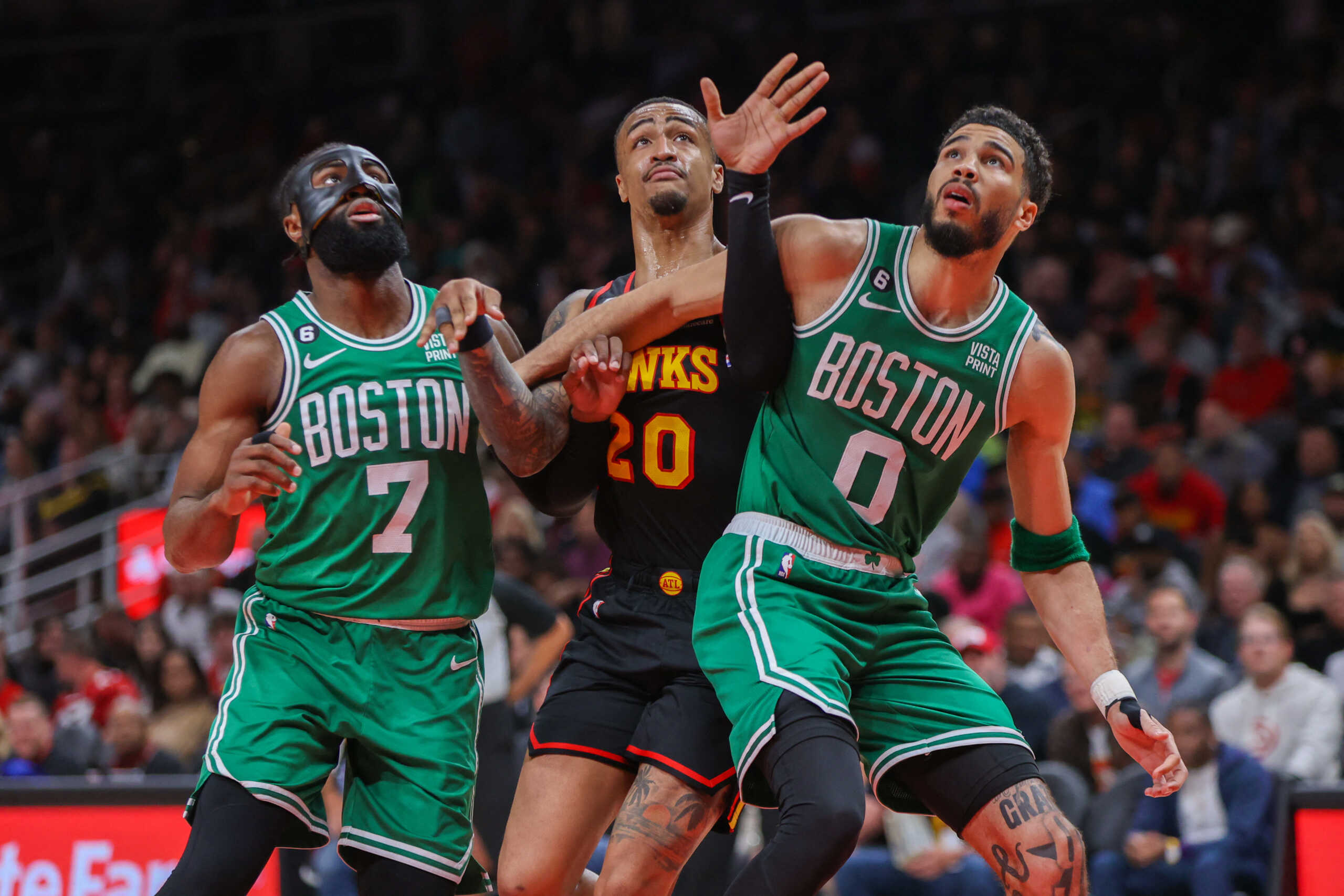 Apr 27, 2023; Atlanta, Georgia, USA; Boston Celtics guard Jaylen Brown (7) and forward Jayson Tatum (0) box out Atlanta Hawks forward John Collins (20) in the second half during game six of the 2023 NBA playoffs at State Farm Arena. Mandatory Credit: Brett Davis-USA TODAY Sports