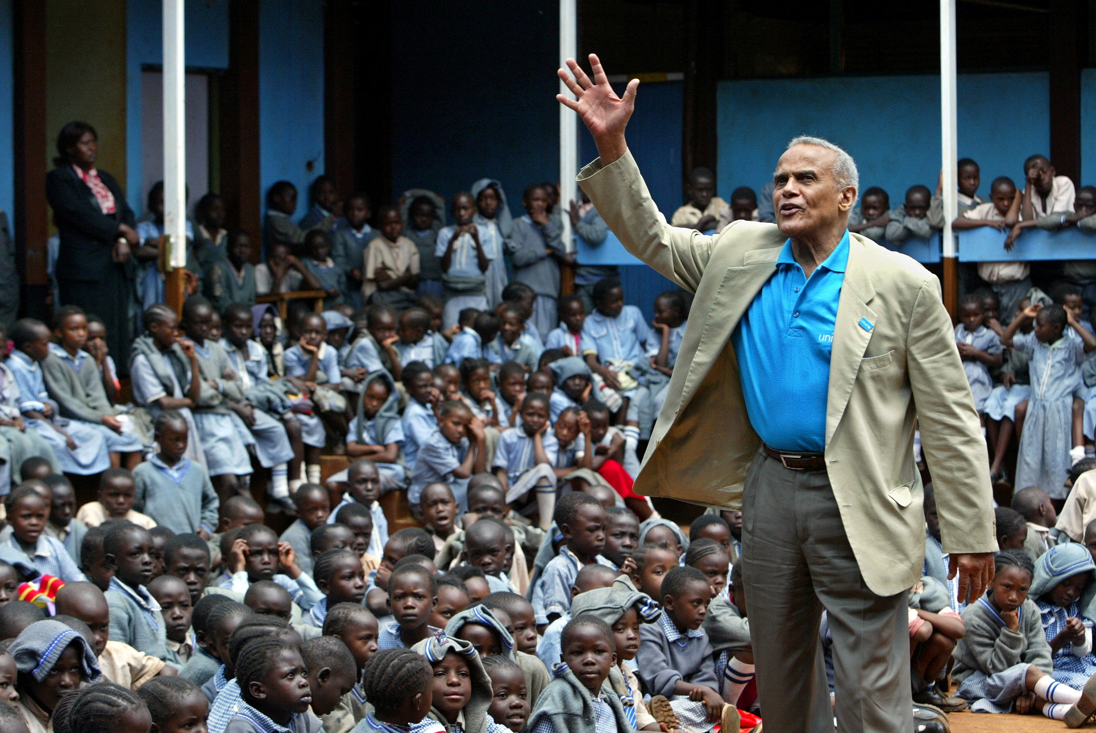 FILE PHOTO: U.S. actor and UNICEF Goodwill ambassador, Harry Belafonte addresses students at a primary school near Kenya's capital Nairobi, February 17, 2004.  REUTERS