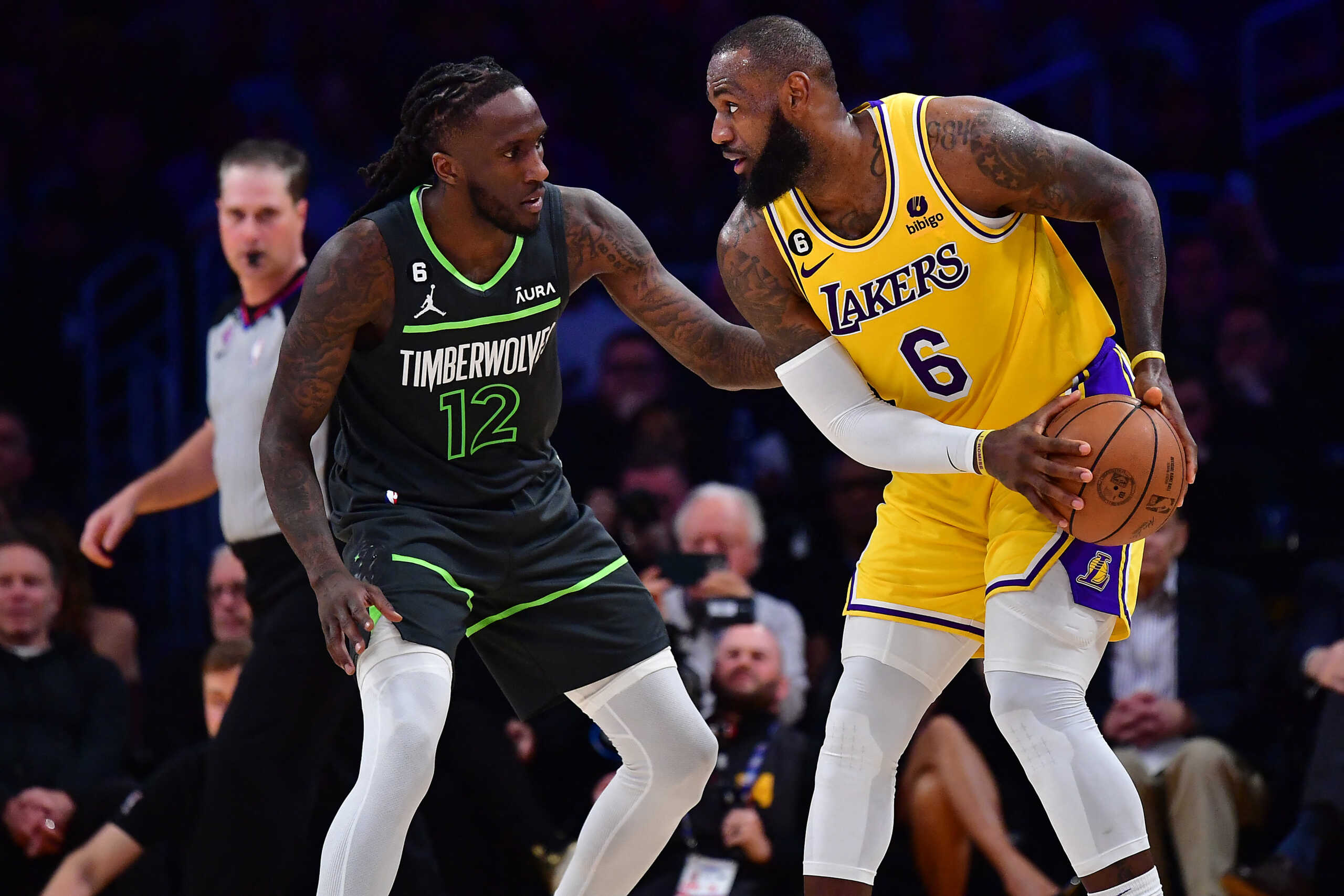 Apr 11, 2023; Los Angeles, California, USA; Los Angeles Lakers forward LeBron James (6) controls the ball against Minnesota Timberwolves forward Taurean Prince (12) during the second half at Crypto.com Arena. Mandatory Credit: Gary A. Vasquez-USA TODAY Sports