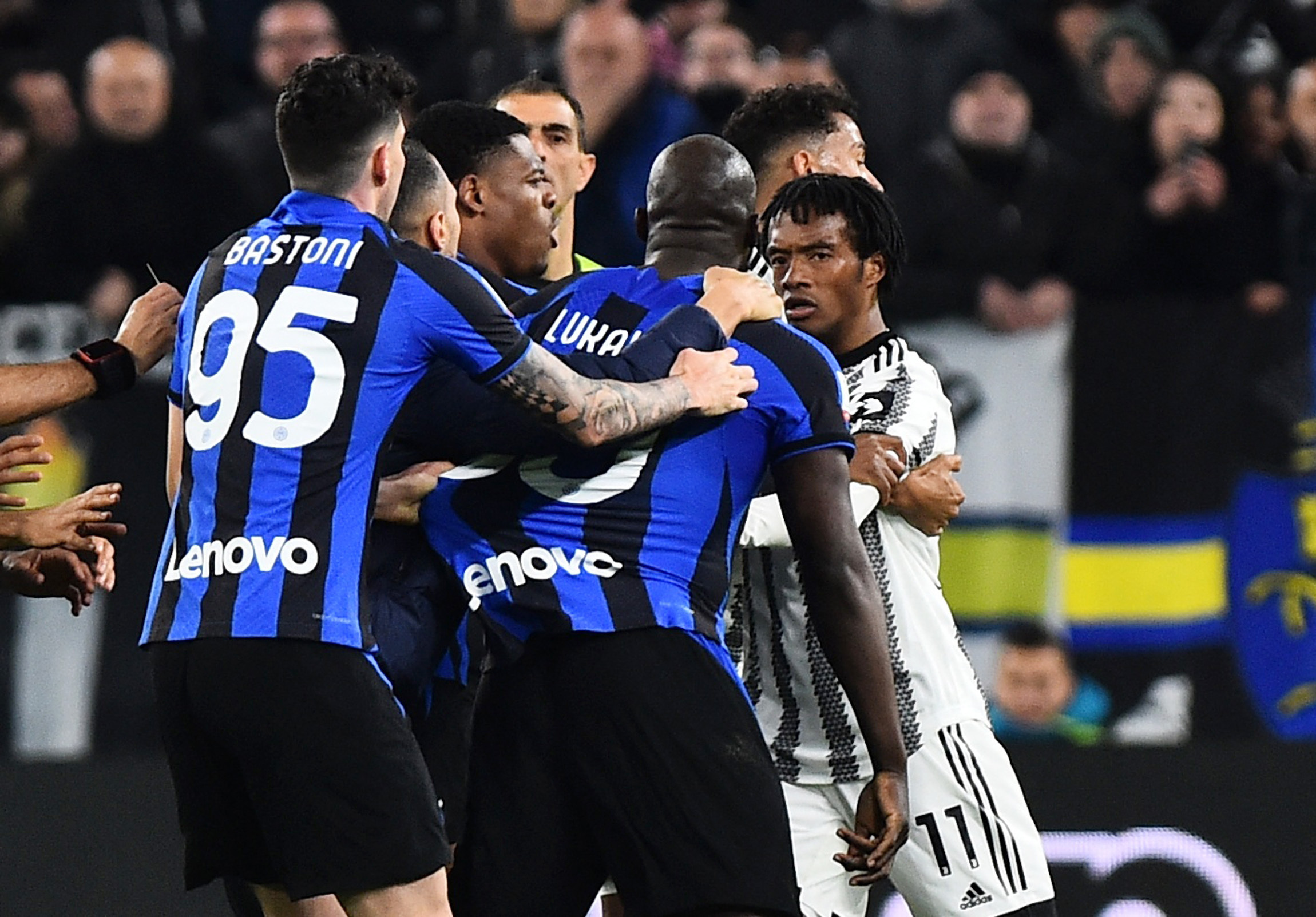 Soccer Football - Coppa Italia - Semi Final - First Leg - Juventus v Inter Milan - Allianz Stadium, Turin, Italy - April 4, 2023  Inter Milan's Romelu Lukaku and Denzel Dumfries clash with Juventus' Juan Cuadrado REUTERS