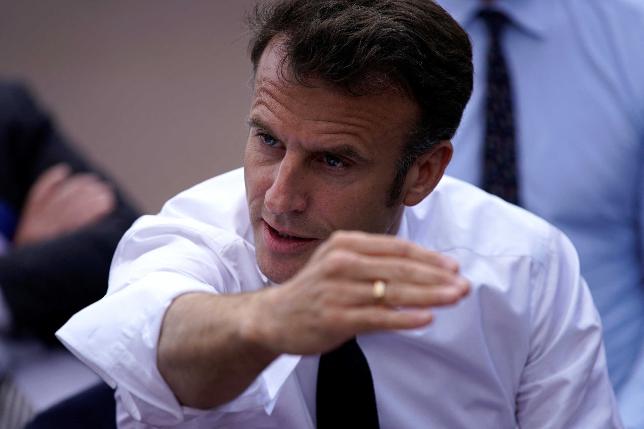 French President Emmanuel Macron speaks to school children, parents and teachers as he visits a middle school, Thursday, April 20, 2023 in Ganges, southern France.  Daniel Cole