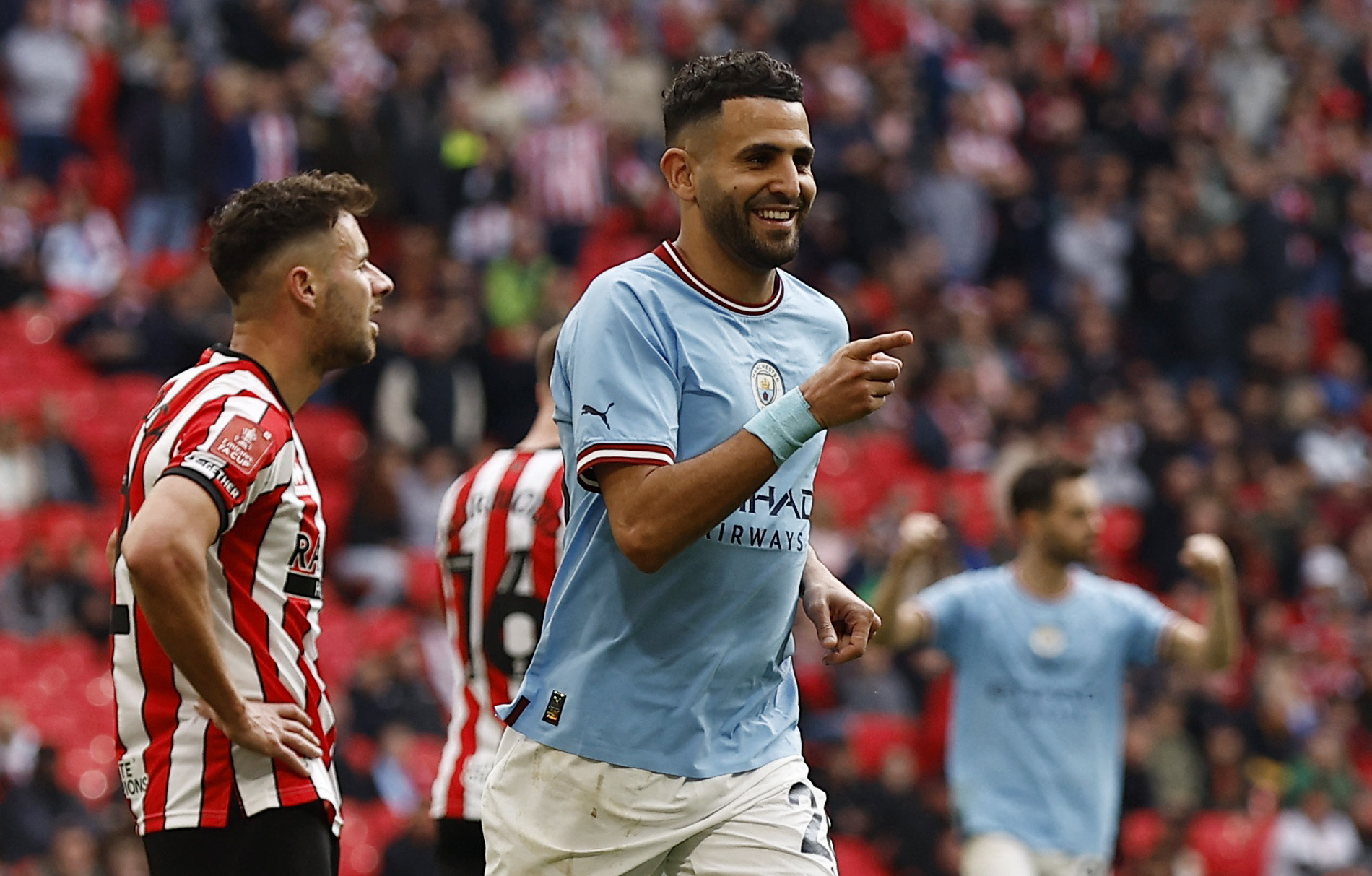 Soccer Football -  FA Cup - Semi Final - Manchester City v Sheffield United - Wembley Stadium, London, Britain - April 22, 2023 Manchester City's Riyad Mahrez celebrates scoring their third goal Action Images via Reuters