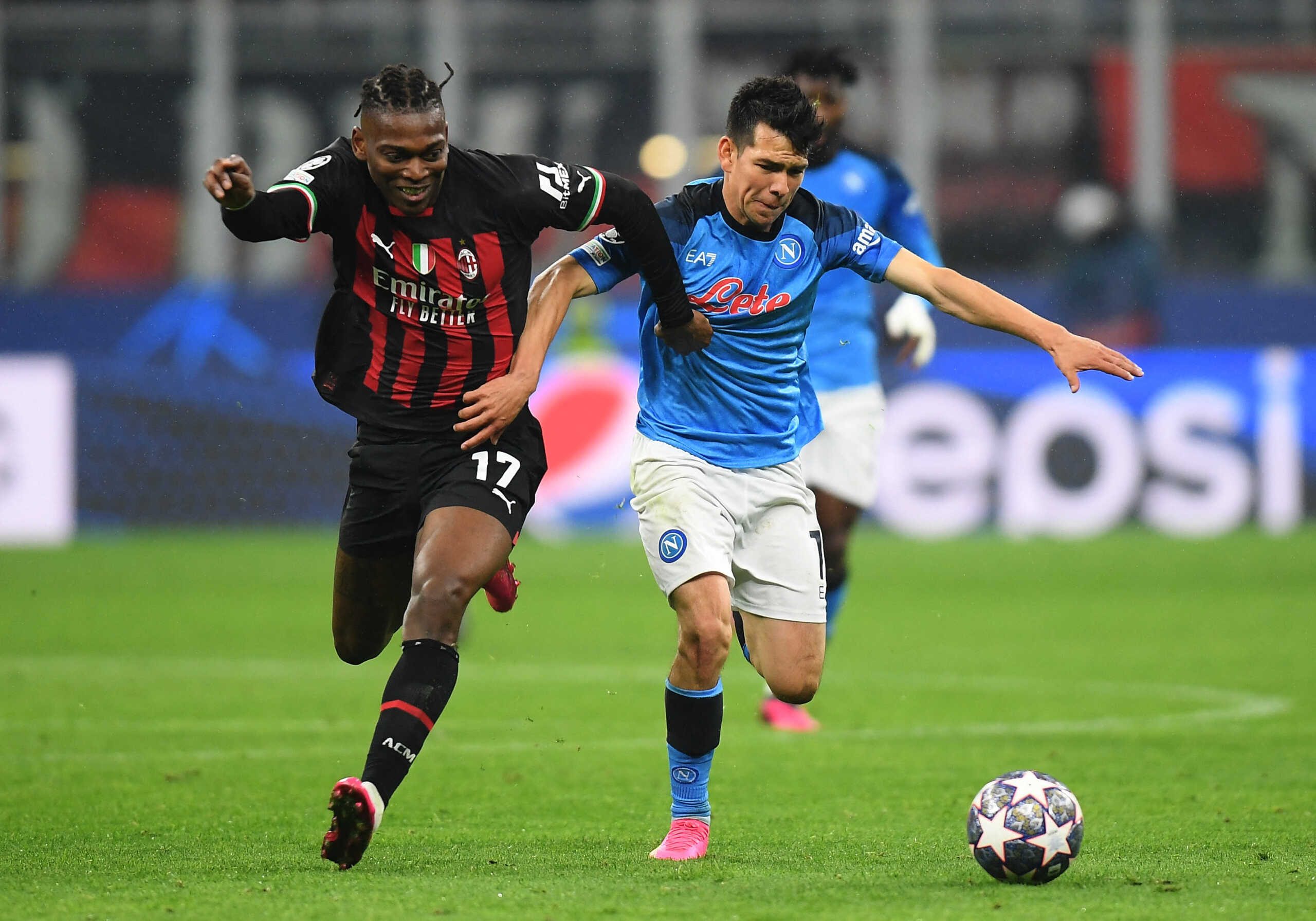 Soccer Football - Champions League - Quarter Finals - First Leg - AC Milan v Napoli - San Siro, Milan, Italy - April 12, 2023 AC Milan's Rafael Leao in action with Napoli's Hirving Lozano REUTERS