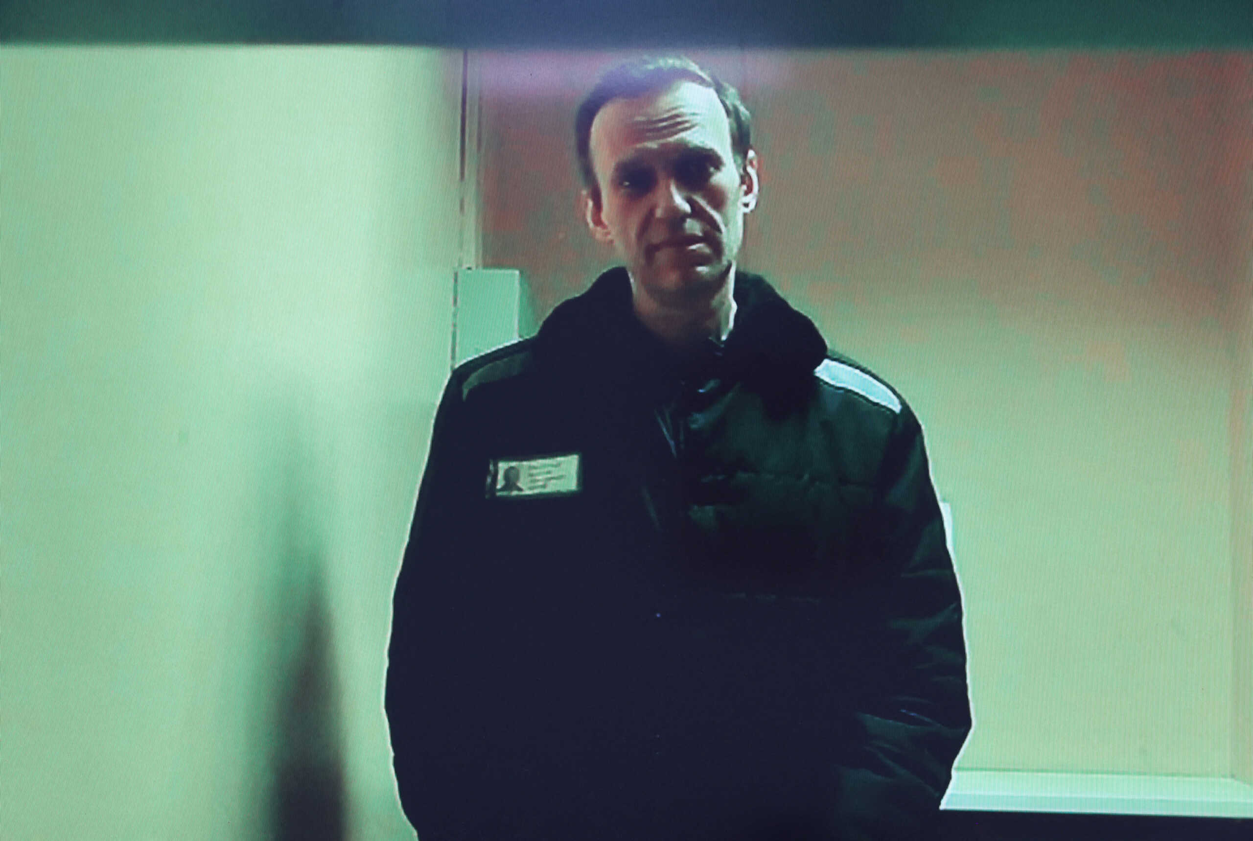 Russian opposition leader Alexei Navalny is seen on a screen via video link from a penal colony in the Vladimir Region during a hearing at the Basmanny district court in Moscow, Russia April 26, 2023. REUTERS