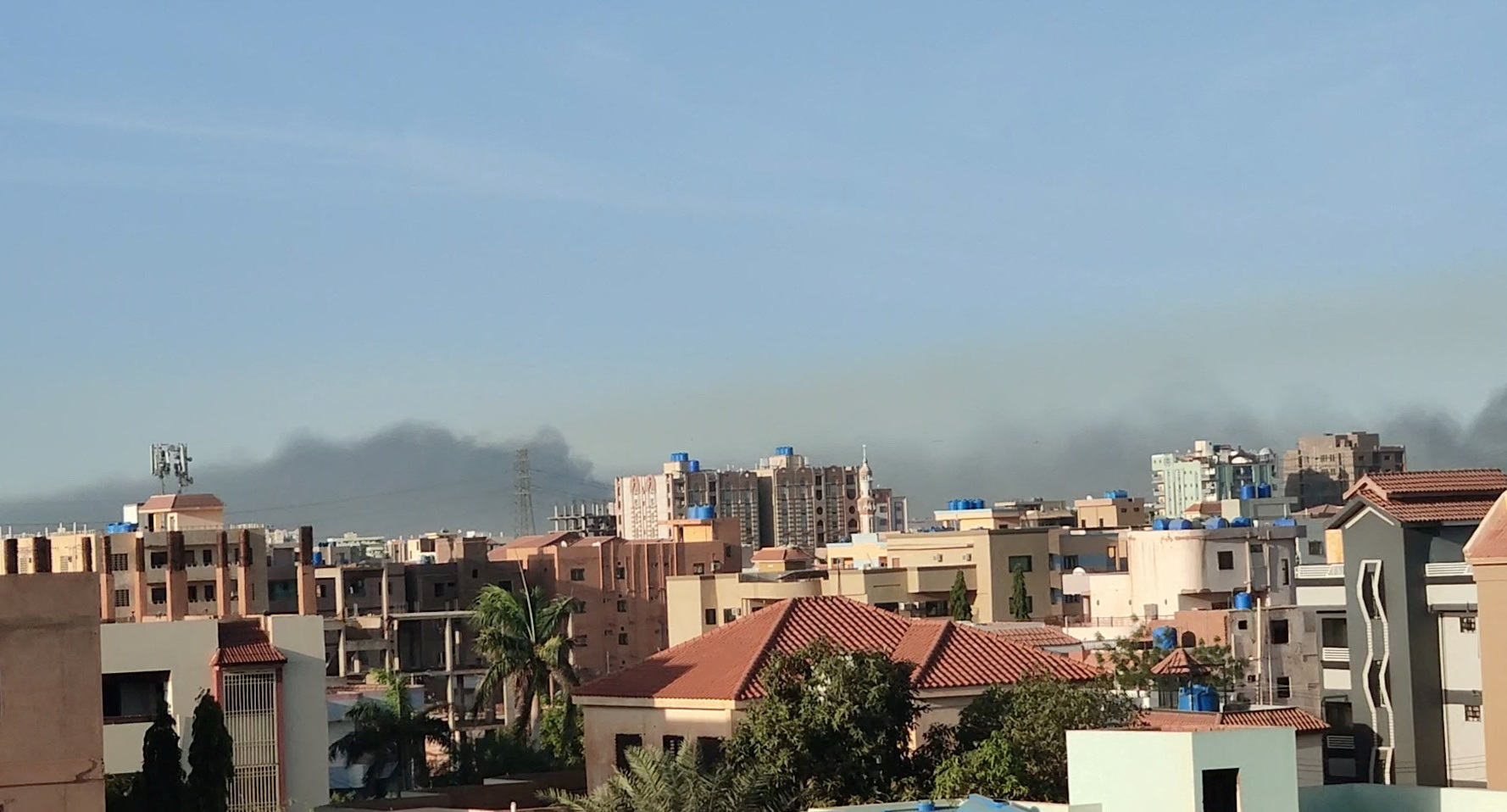 A general view shows a cloud of smoke in Khartoum, Sudan, April 18, 2023 in this screen grab obtained from a social media video. Twitter @ayman_amin_