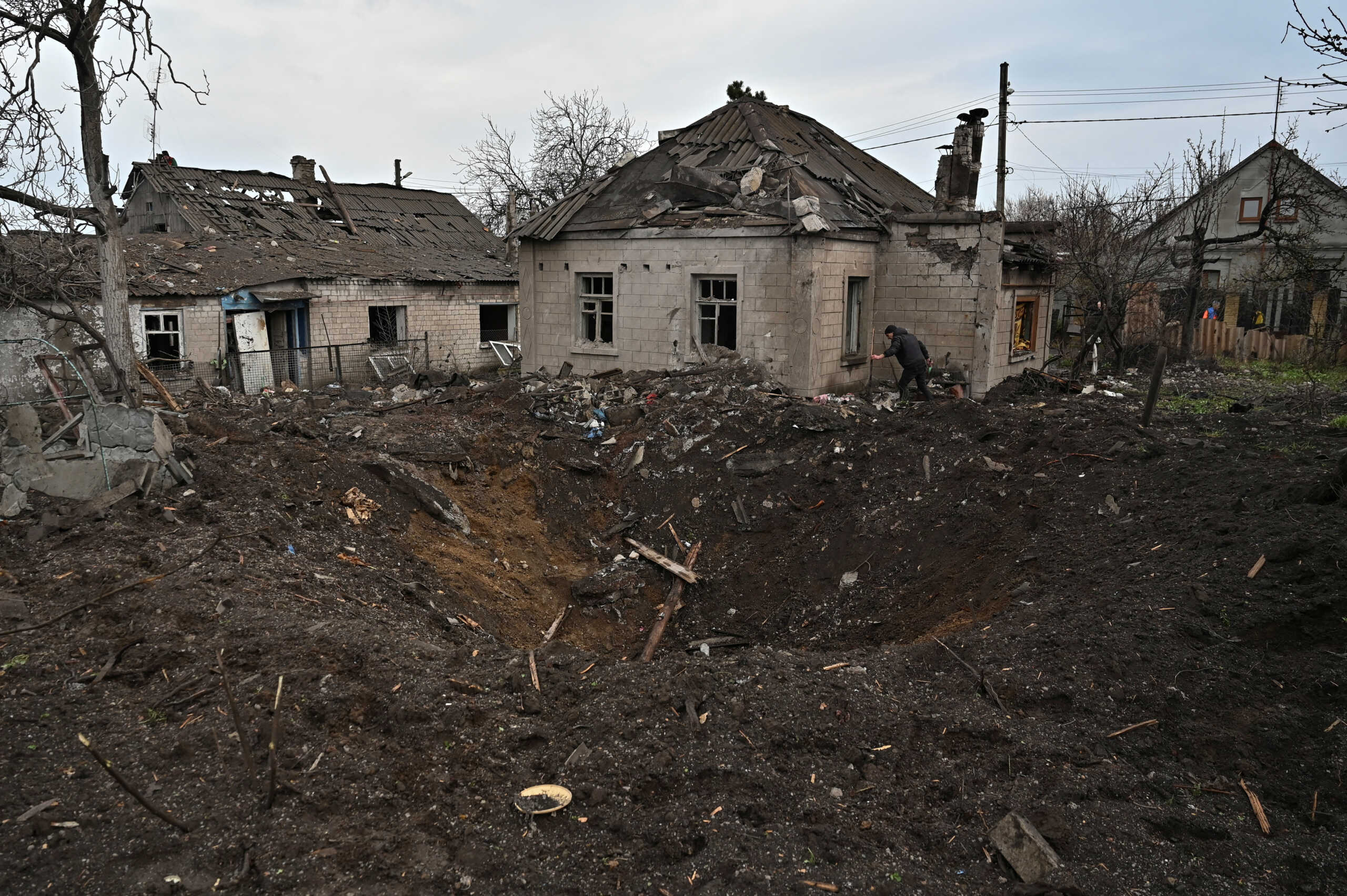 A local resident removes debris from his house damaged by a Russian missile strike, amid Russia's attack on Ukraine, in Zaporizhzhia, Ukraine April 9, 2023. REUTERS