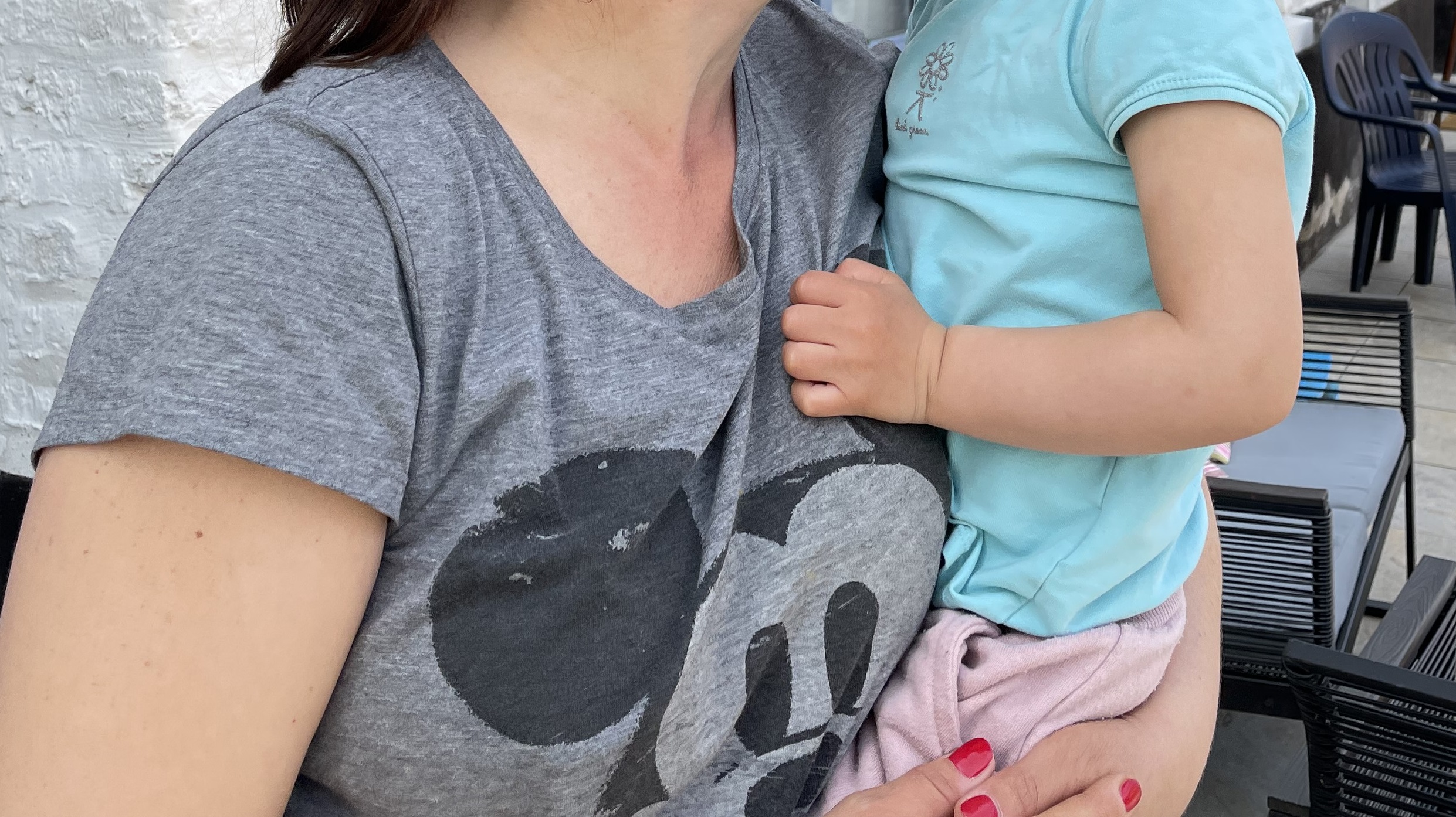 Ukrainian refugee Alina Hanich kisses daughter Alisa, 2, at a farm in Tilques, northern France, where she is living after fleeing their home in the central-eastern city of Dnipro. May 10, 2022. Thomson Reuters Foundation