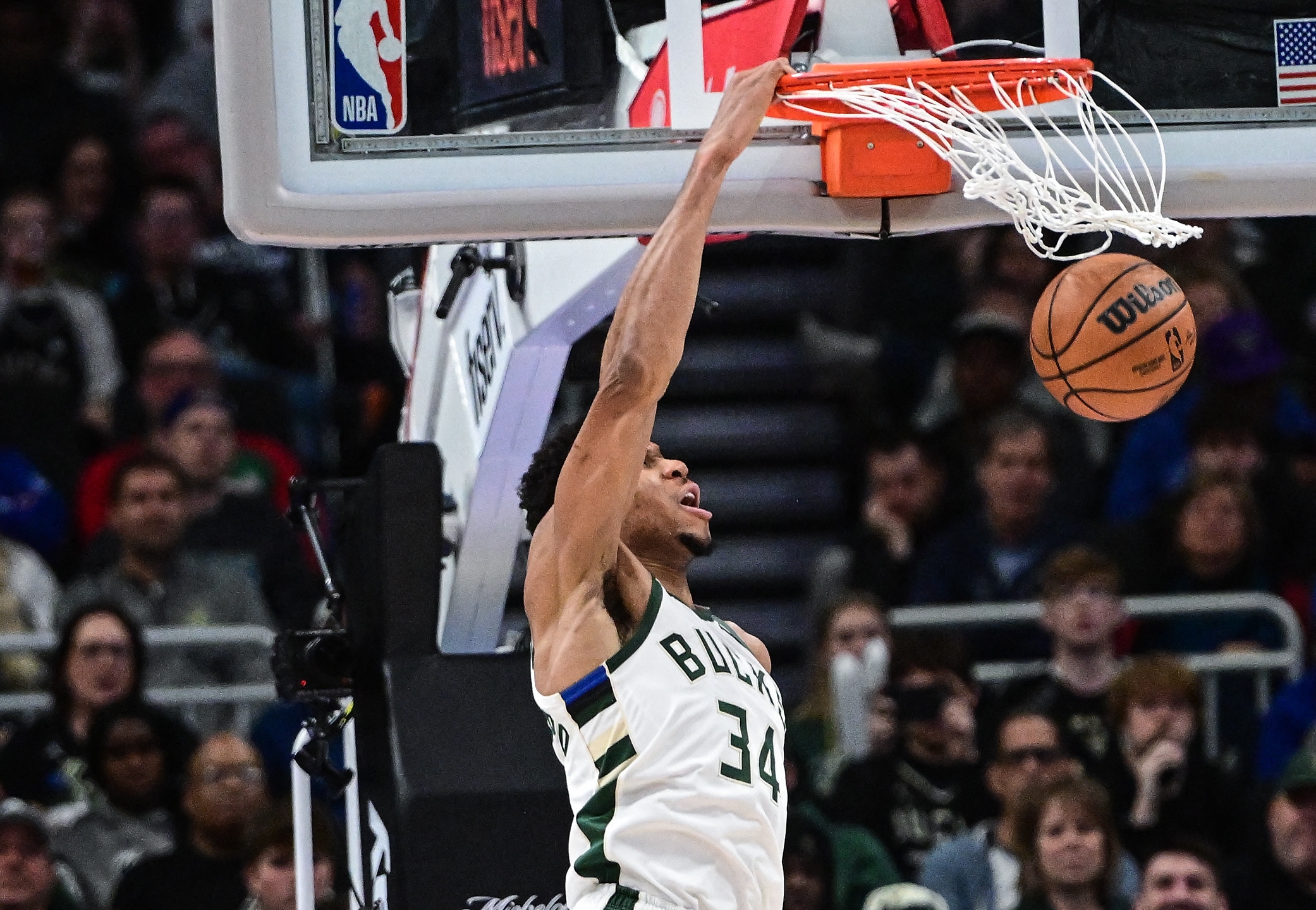 Apr 2, 2023; Milwaukee, Wisconsin, USA; Milwaukee Bucks forward Giannis Antetokounmpo (34) dunks the ball against Philadelphia 76ers center Danuel House Jr. (25) in the third quarter at Fiserv Forum. Mandatory Credit: Benny Sieu-USA TODAY Sports