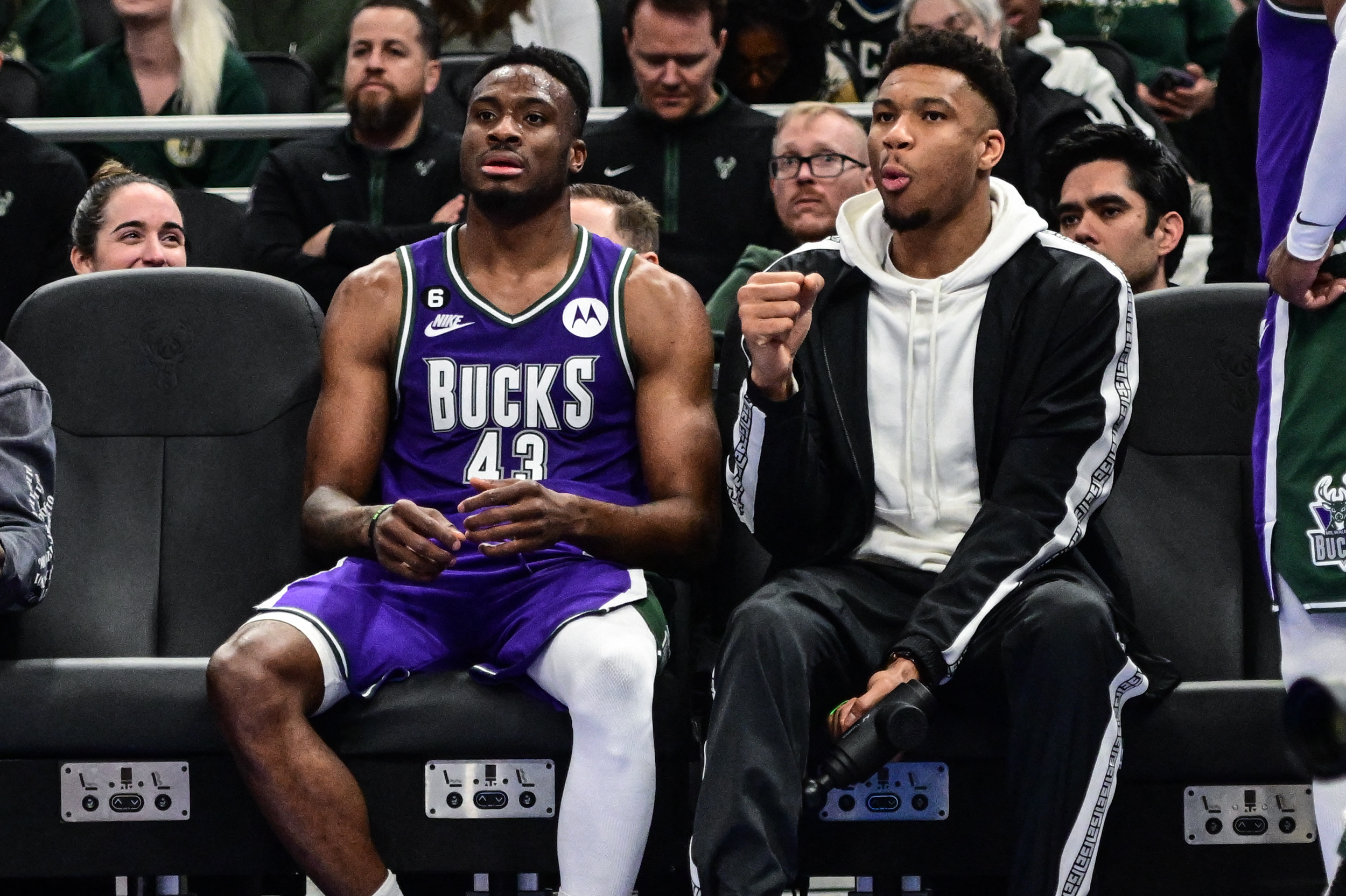 Apr 7, 2023; Milwaukee, Wisconsin, USA; Milwaukee Bucks forward Giannis Antetokounmpo (34) sits with his brother forward Thanasis Antetokounmpo (43) in the fourth quarter during game against the Memphis Grizzlies at Fiserv Forum. Mandatory Credit: Benny Sieu-USA TODAY Sports