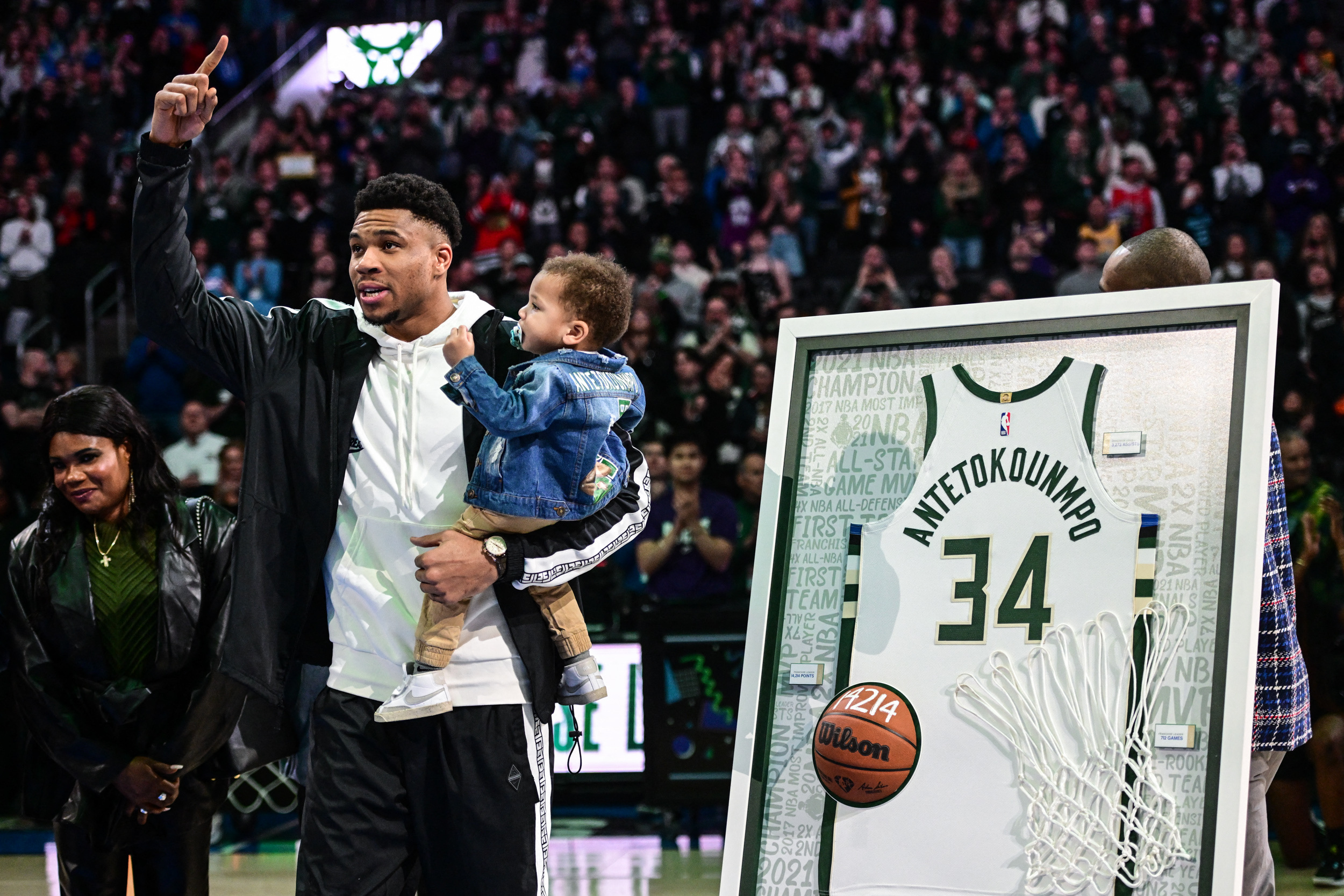 Apr 7, 2023; Milwaukee, Wisconsin, USA; Milwaukee Bucks forward Giannis Antetokounmpo (34) holds his child, Shai, during ceremony recognizing his 10-year accomplishments with the team before game against Memphis Grizzlies at Fiserv Forum. Mandatory Credit: Benny Sieu-USA TODAY Sports