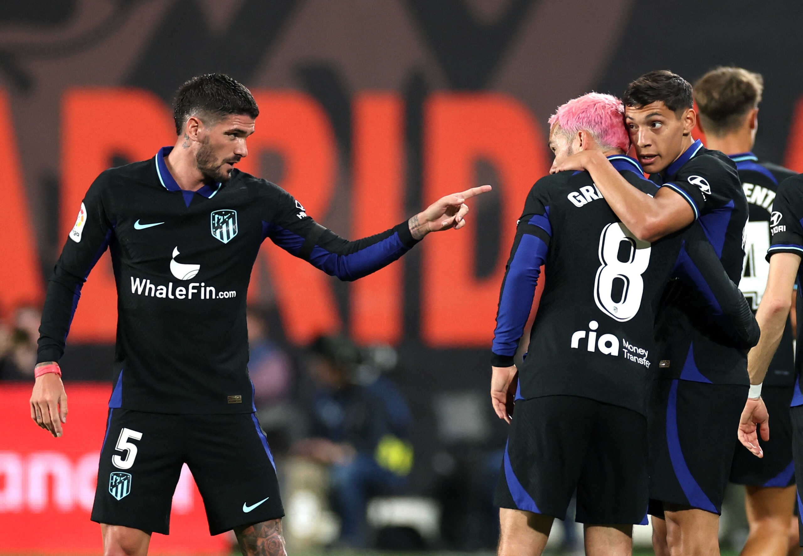 Soccer Football - LaLiga - Rayo Vallecano v Atletico Madrid - Campo de Futbol de Vallecas, Madrid, Spain - April 9, 2023 Atletico Madrid's Nahuel Molina celebrates scoring their first goal with Antoine Griezmann and Rodrigo de Paul REUTERS