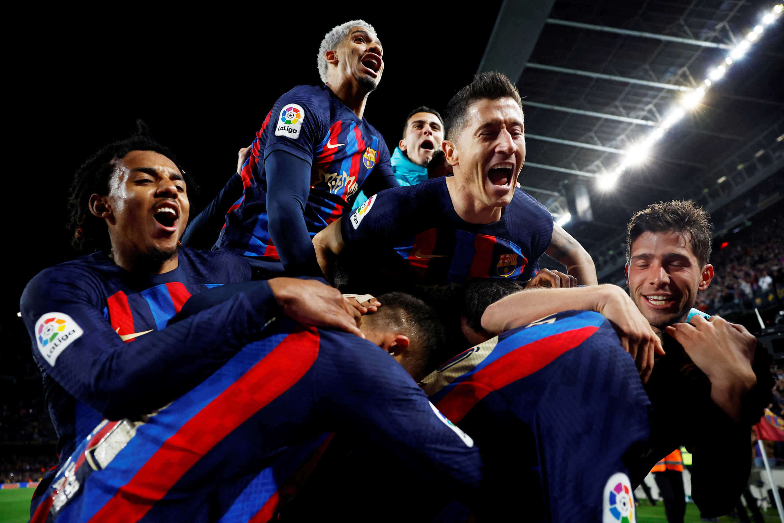 Soccer Football - LaLiga - FC Barcelona v Real Madrid - Camp Nou, Barcelona, Spain - March 19, 2023 FC Barcelona's Franck Kessie celebrates scoring their second goal with Robert Lewandowski and teammates REUTERS