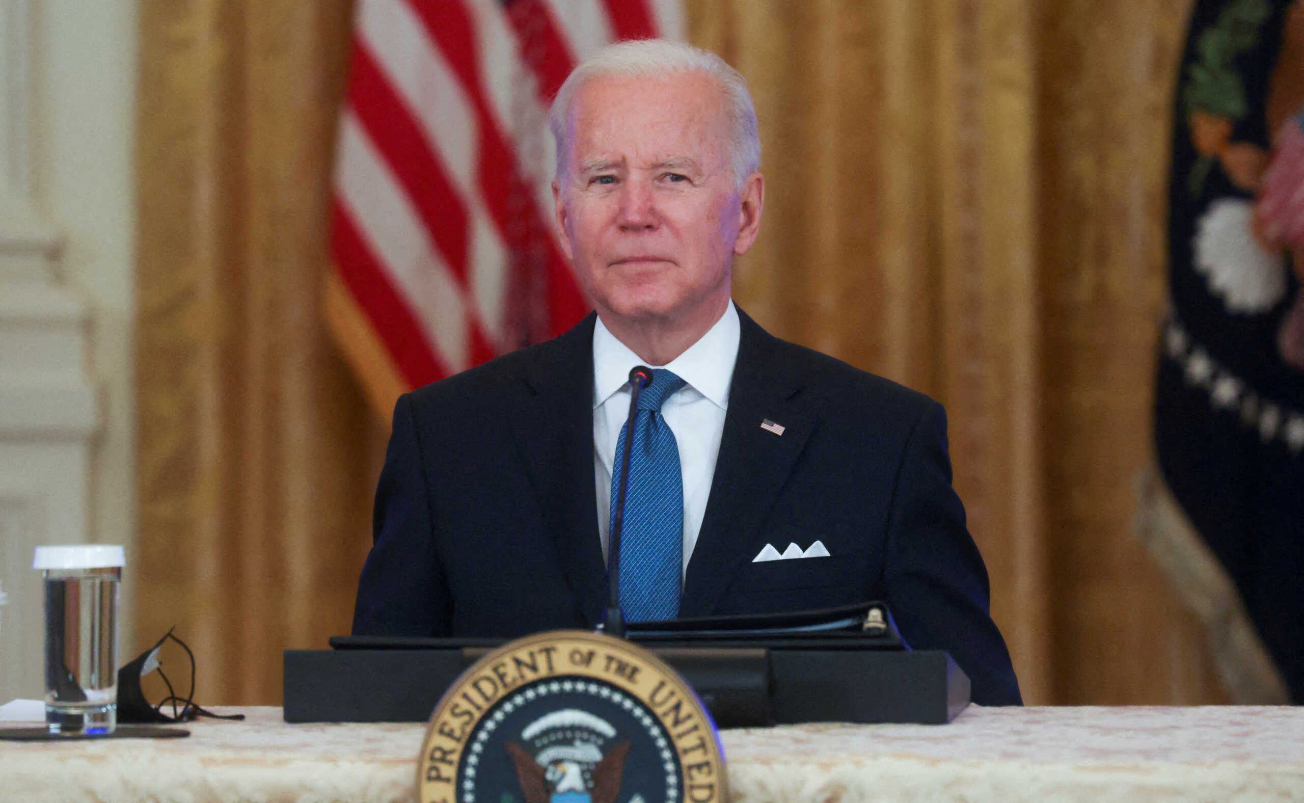 FILE PHOTO: U.S. President Joe Biden listens to a question from Fox News reporter Peter Doocy after having a meeting with his Competition Council to speak about inflation and lowering prices for families in the East Room of the White House, in Washington, U.S. January 24, 2022. REUTERS
