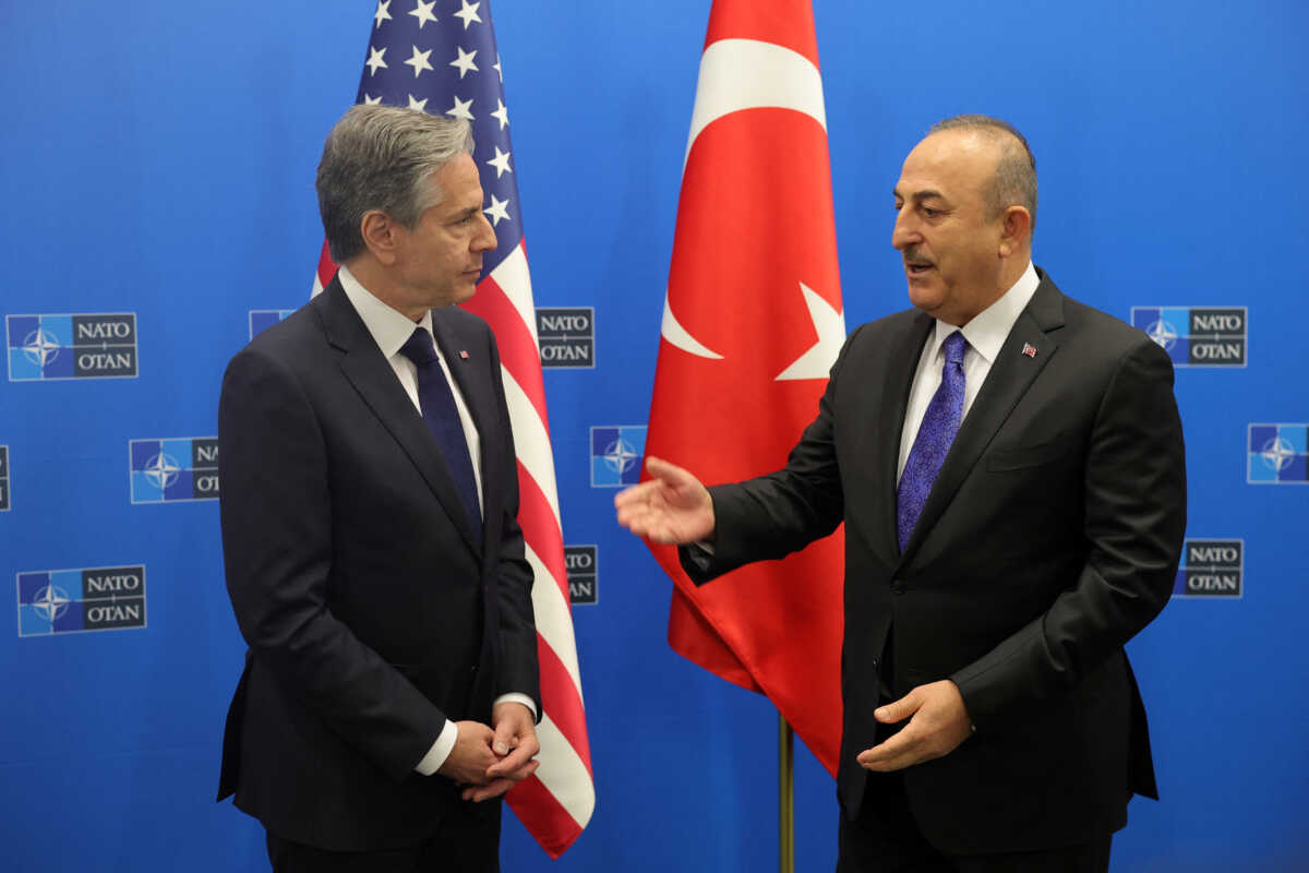 Turkish Foreign Minister Mevlut Cavusoglu poses with U.S. Secretary of State Antony Blinken, during NATO foreign ministers' meeting at NATO headquarters in Brussels, Belgium, 04 April 2023. Finland becomes the 31st member of the Alliance on 04 April.   OLIVIER MATTHYS