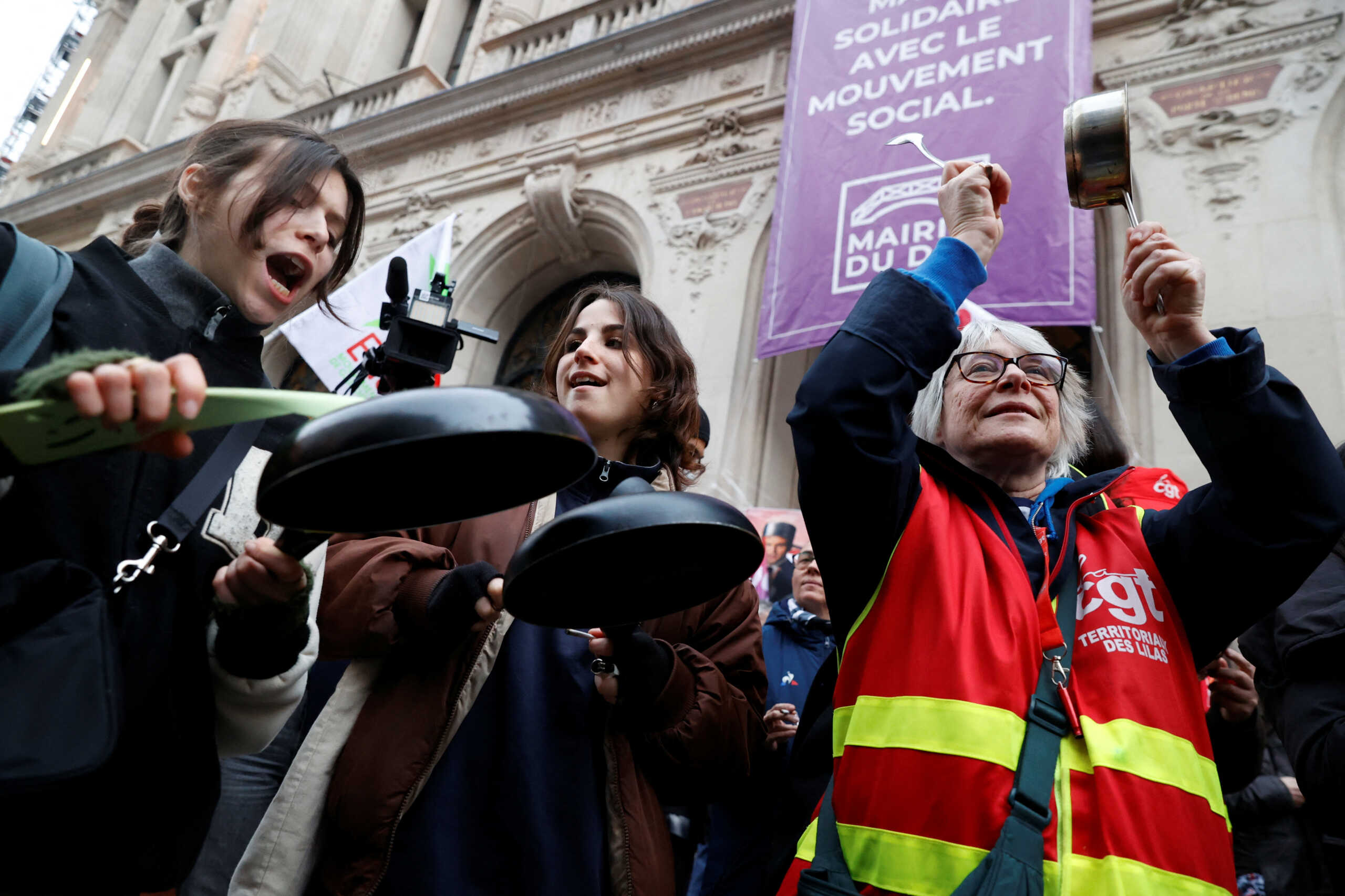 Protesters bang on a pots during demonstration following a special address to the nation by French President Emmanuel Macron, after he signed into law the pension reform raising the retirement age, in Paris, France, April 17, 2023. REUTERS