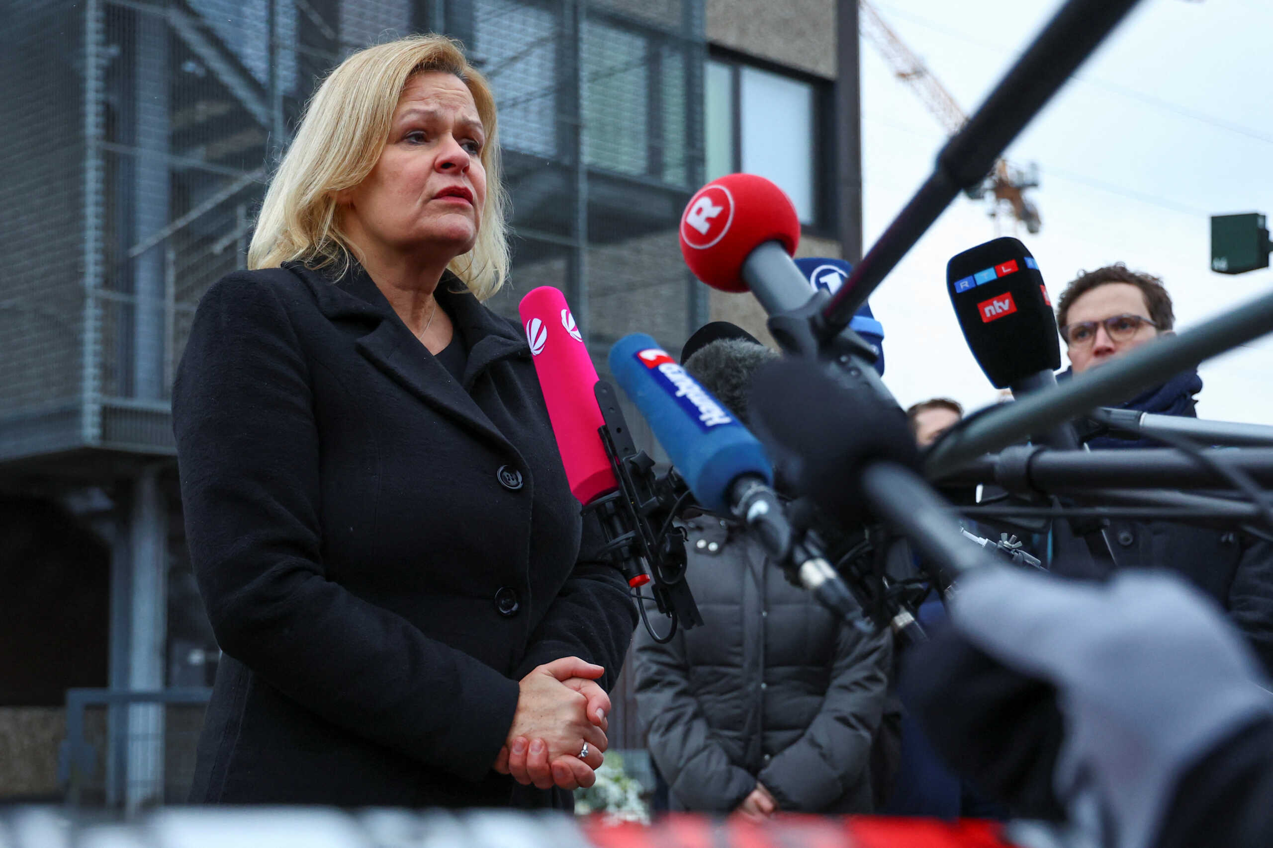 German Interior Minister Nancy Faeser speaks to the media during a visit to the site of a deadly shooting at a Kingdom Hall of Jehovah's Witnesses in Hamburg, Germany, March 10, 2023.  REUTERS