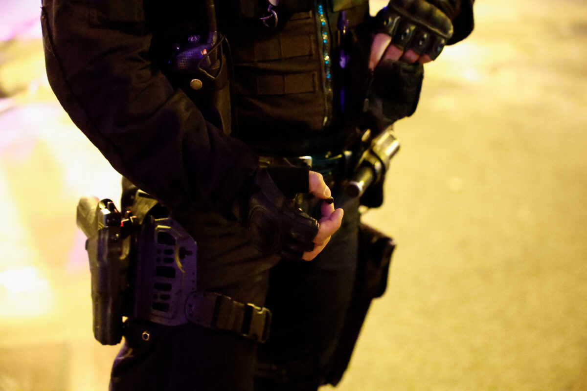 A police officer holds a bullet shell during an operation following a security incident on the sidelines of a gathering to condemn police violence, and in support of two protesters who fell into a coma after being injured in clashes against police in Sainte-Soline, in Paris, France, March 30, 2023. REUTERS