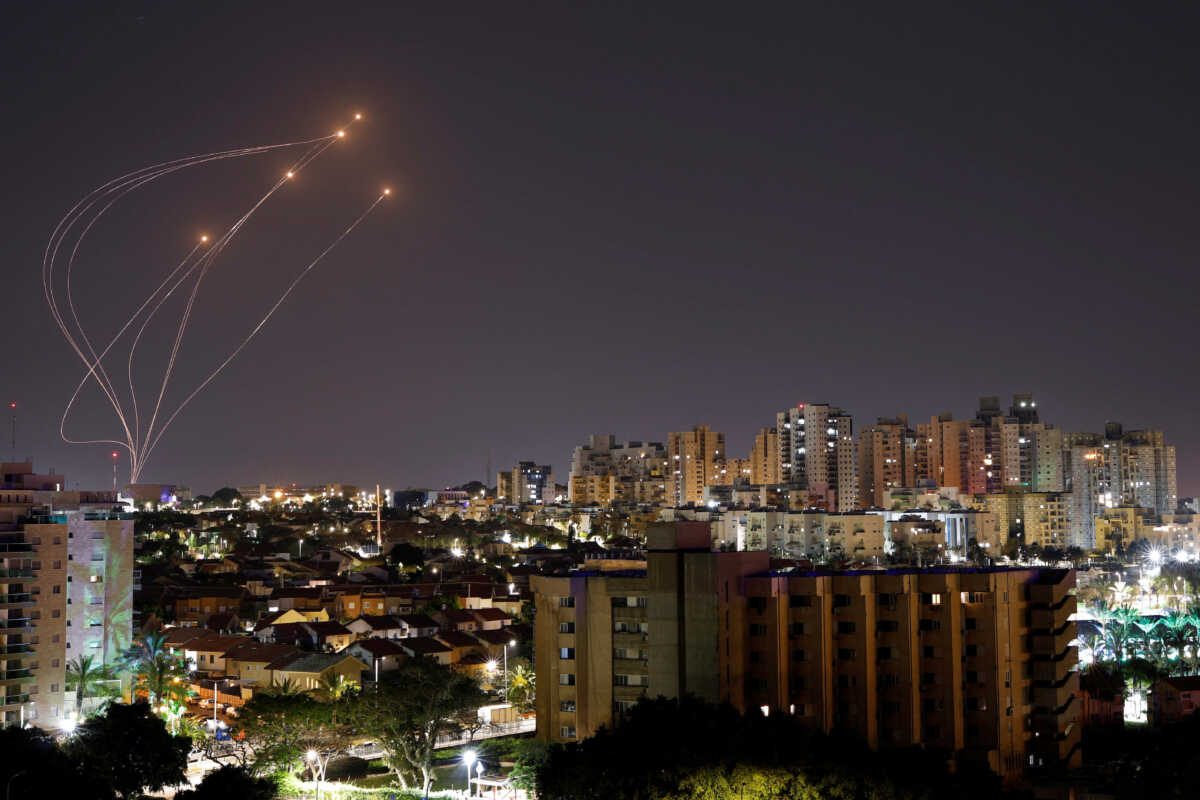 Streaks of light are seen as Israel's Iron Dome anti-missile system intercept rockets launched from the Gaza Strip, as seen from Ashkelon, April 7, 2023.  REUTERS