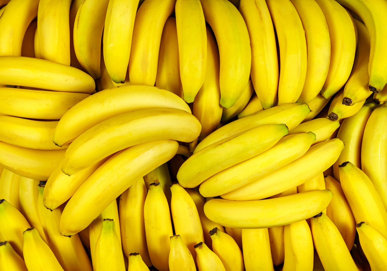 Background of many banana pieces, overhead view, studio food photography. Macro