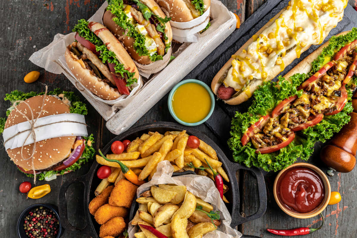 American fast food. Hamburgers, French fries, hot dogs. fast food and unhealthy eating concept. top view.