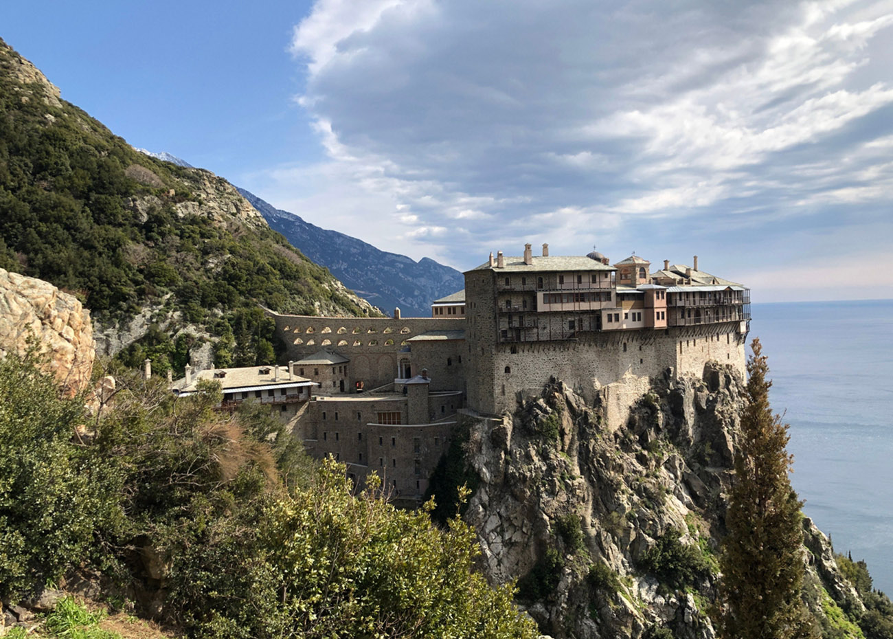 The beautiful view of Simonopetra Monastery and a cloudy sky in Greece