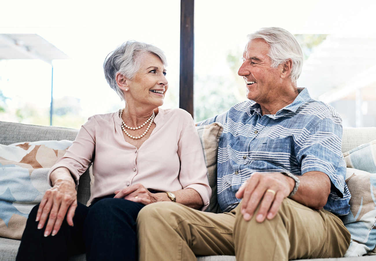 Shot of a happy senior couple relaxing on the sofa together at home