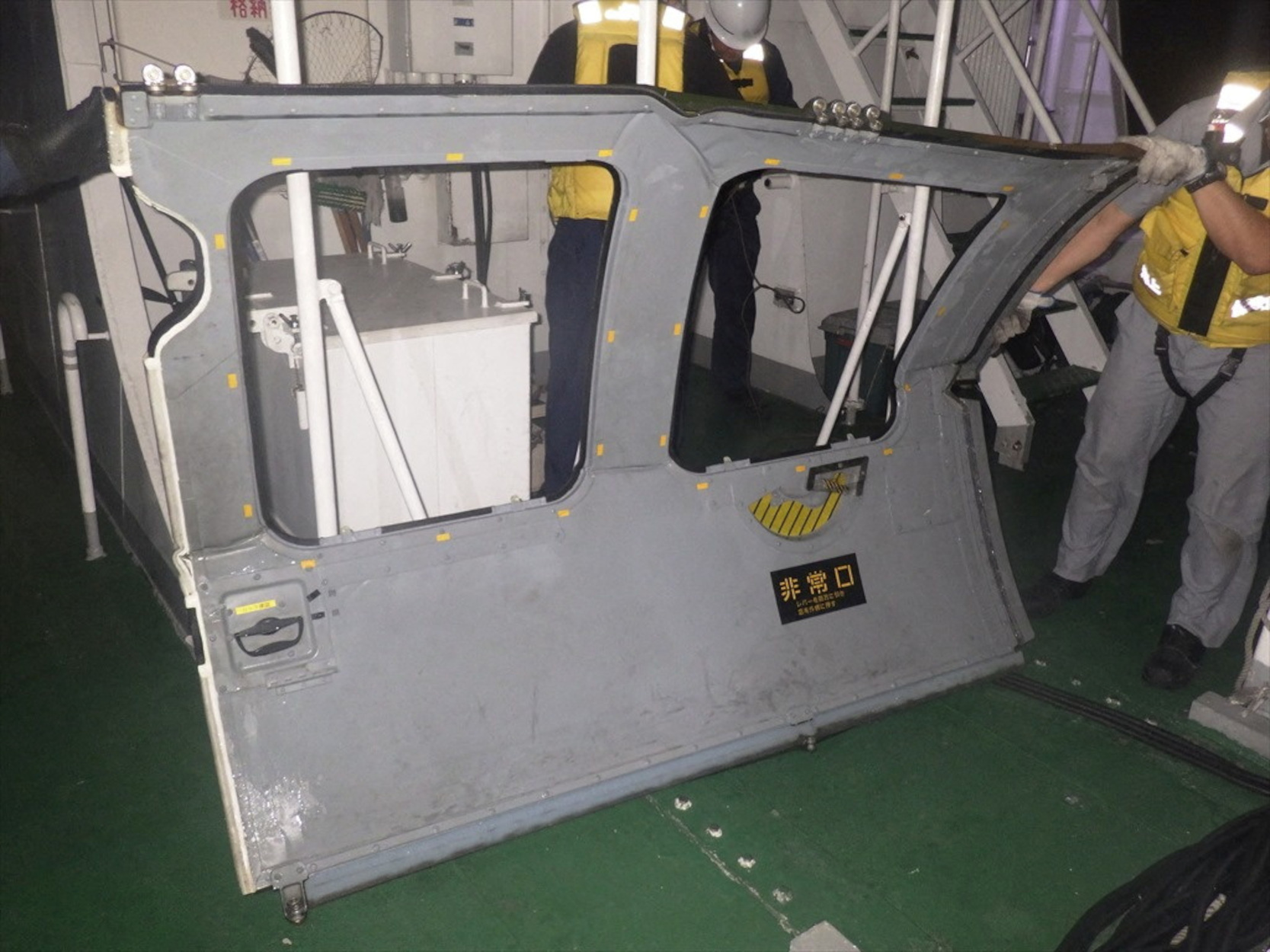 An unidentified object which was floating in the ocean near the site of a military helicopter that crashed in the sea is seen on a ship after it was recovered from the sea near Miyakojima, Okinawa Prefecture, Japan, in this handout photo taken on April 7, 2023. 11th Regional Coast Guard Headquarters-Japan Coast Guard