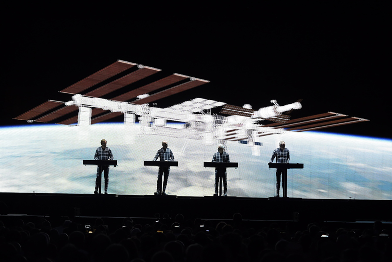 epa06905001 German music band Kraftwerk perform during a concert of the Jazz Open Stuttgart 2018 Festival at the Schlossplatz, in Stuttgart, Germany, 20 July 2018 (issued 22 July 2018), as they are joined by German astronaut Alexander Gerst (unseen) via video chat from the International Space Station (ISS). The in-orbit astronaut and Kraftwerk performed the band's 1978 song 'Spacelab'.  EPA