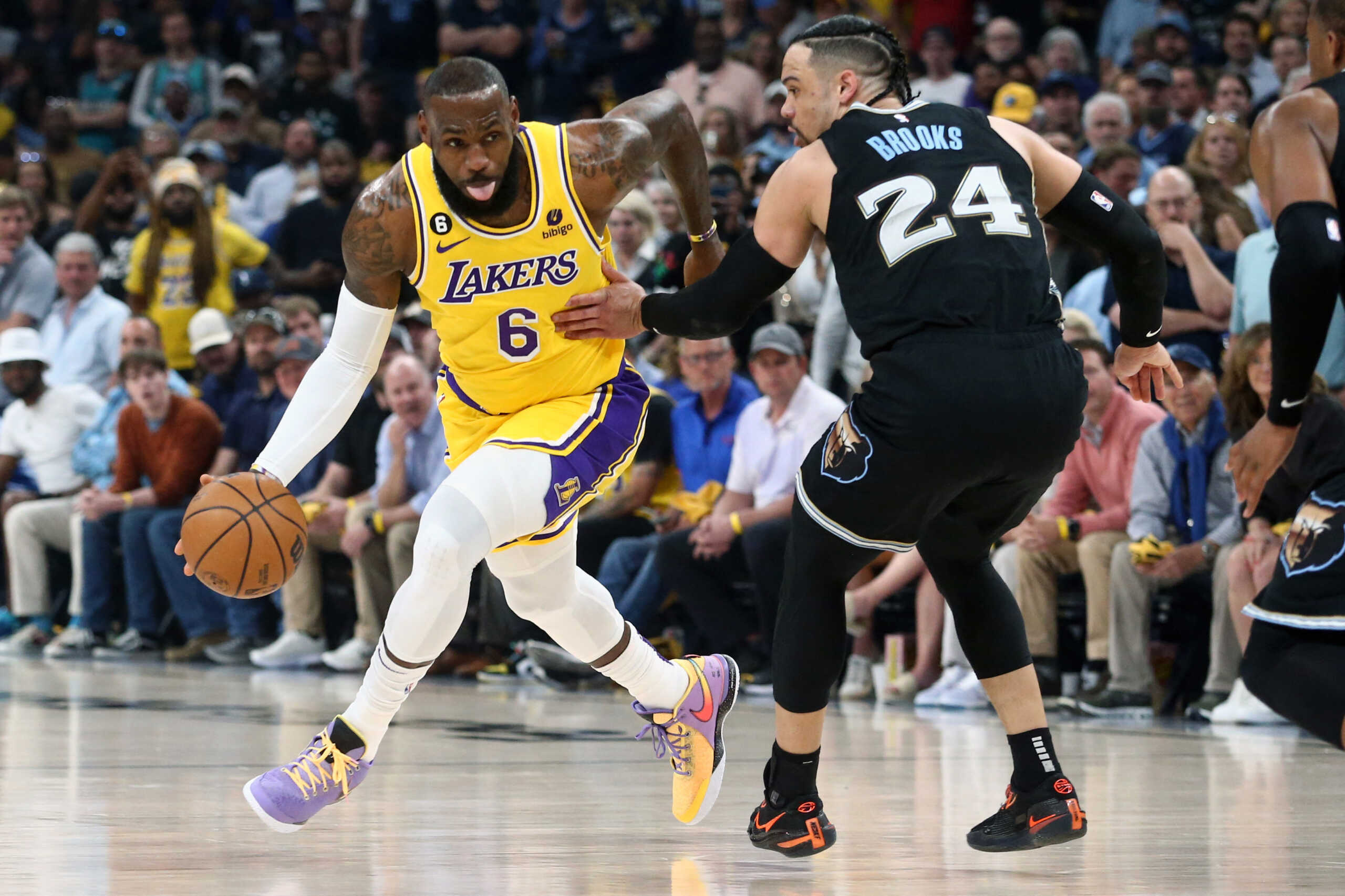 Apr 19, 2023; Memphis, Tennessee, USA; Los Angeles Lakers forward LeBron James (6) dribbles as Memphis Grizzlies forward Dillon Brooks (24) defends during the first half of game two of the 2023 NBA playoffs at FedExForum. Mandatory Credit: Petre Thomas-USA TODAY Sports