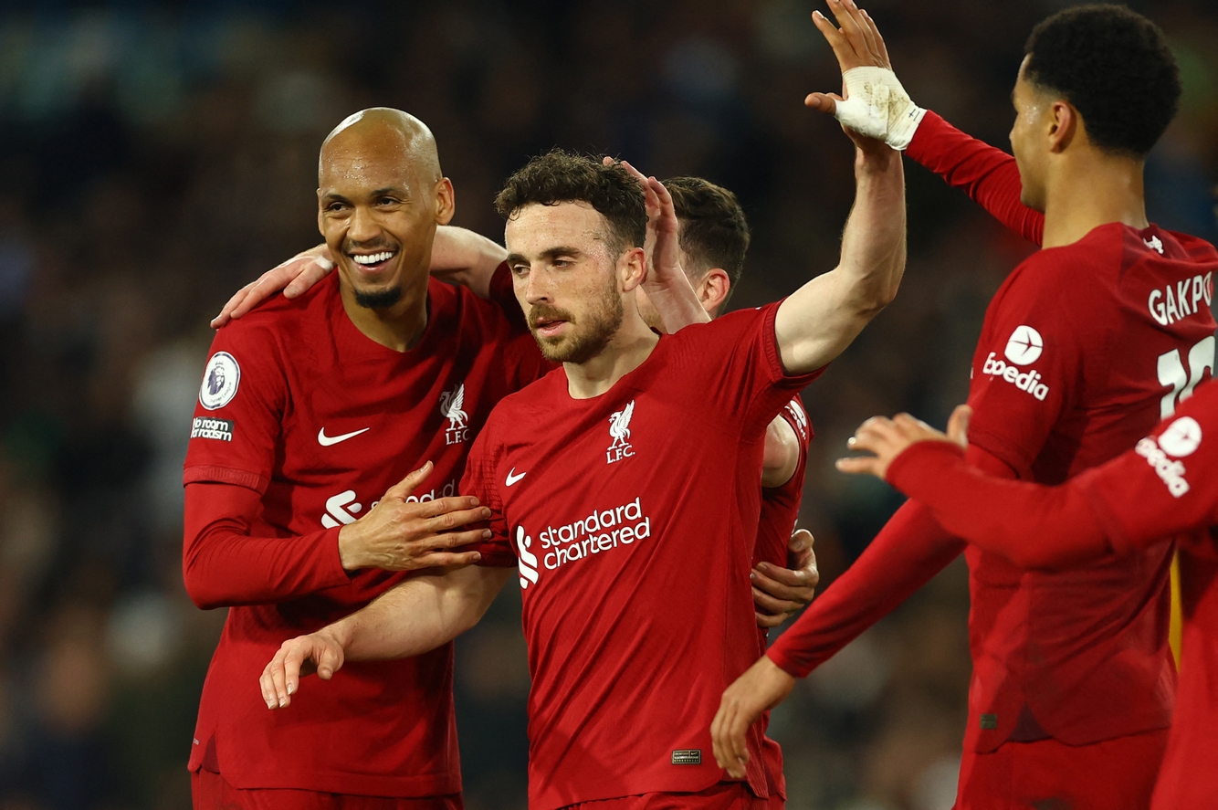 Soccer Football - Premier League - Leeds United v Liverpool - Elland Road, Leeds, Britain - April 17, 2023 Liverpool's Diogo Jota celebrates scoring their fifth goal with Fabinho and Cody Gakpo REUTERS