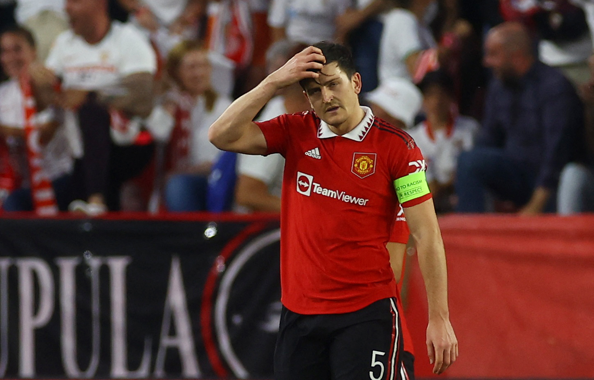 Soccer Football - Europa League - Quarter Final - Second Leg - Sevilla v Manchester United - Ramon Sanchez Pizjuan, Seville, Spain - April 20, 2023 Manchester United's Harry Maguire looks dejected after Sevilla's Youssef En-Nesyri scores their first goal Action Images via Reuters