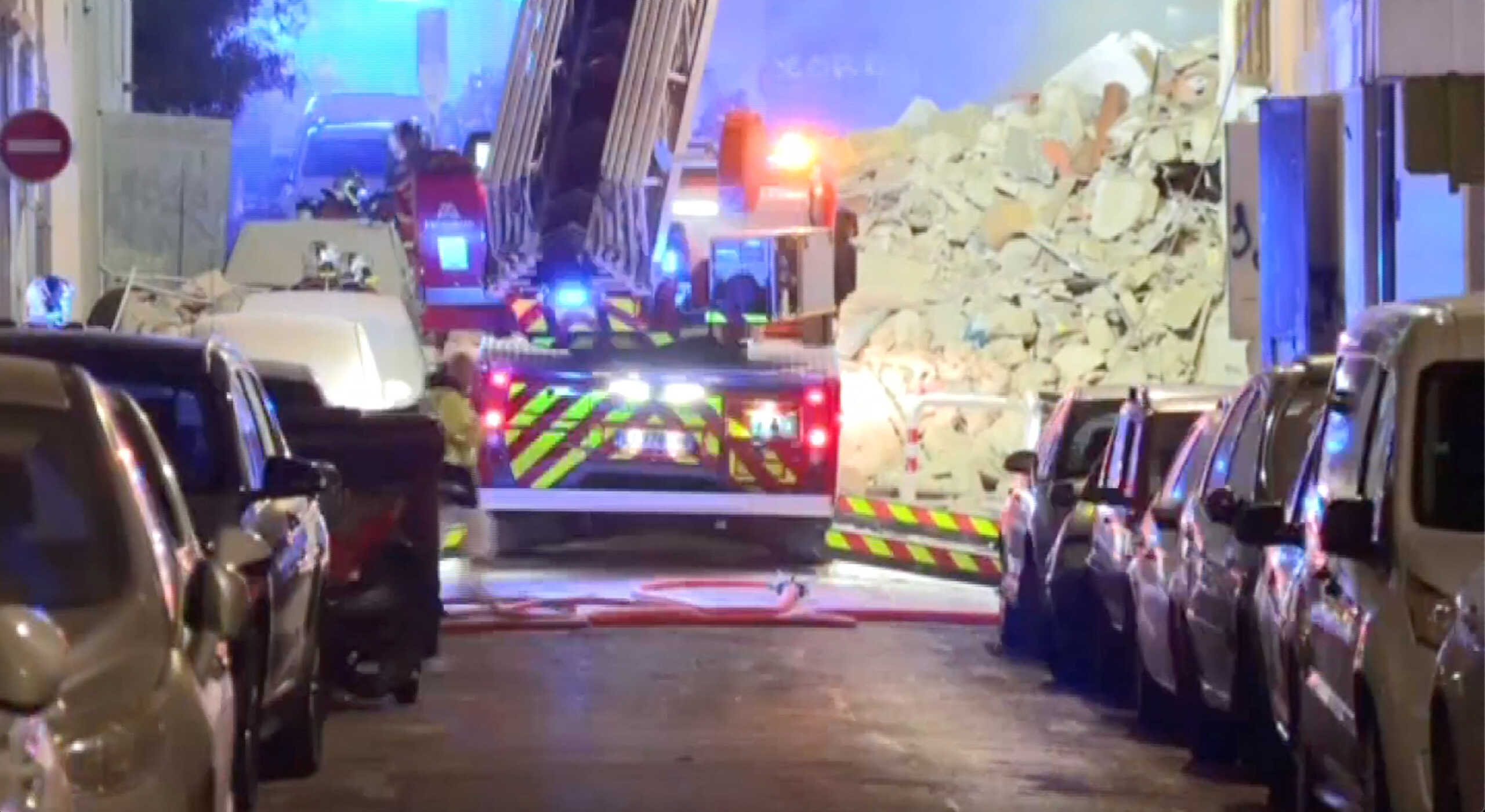A fire truck stands next to a collapsed building in Marseille, France, April 9, 2023, in this screengrab obtained from a social media video. BFMTV