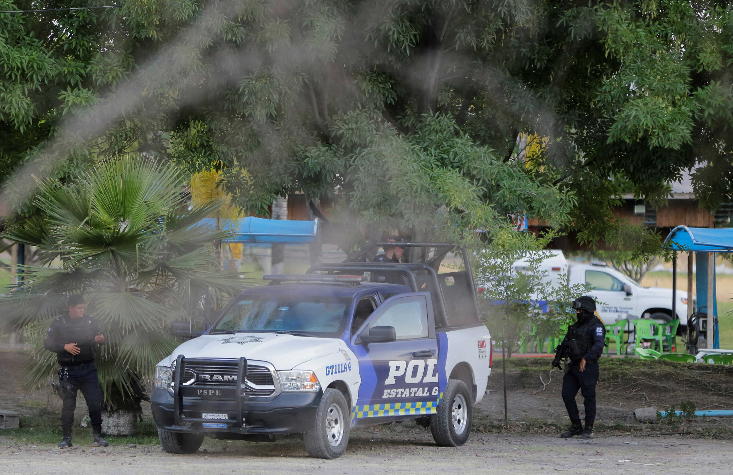 Authorities work at a crime scene where gunmen killed several people including a minor after storming a water park, in Cortazar, Guanajuato state, Mexico April 15, 2023.REUTERS