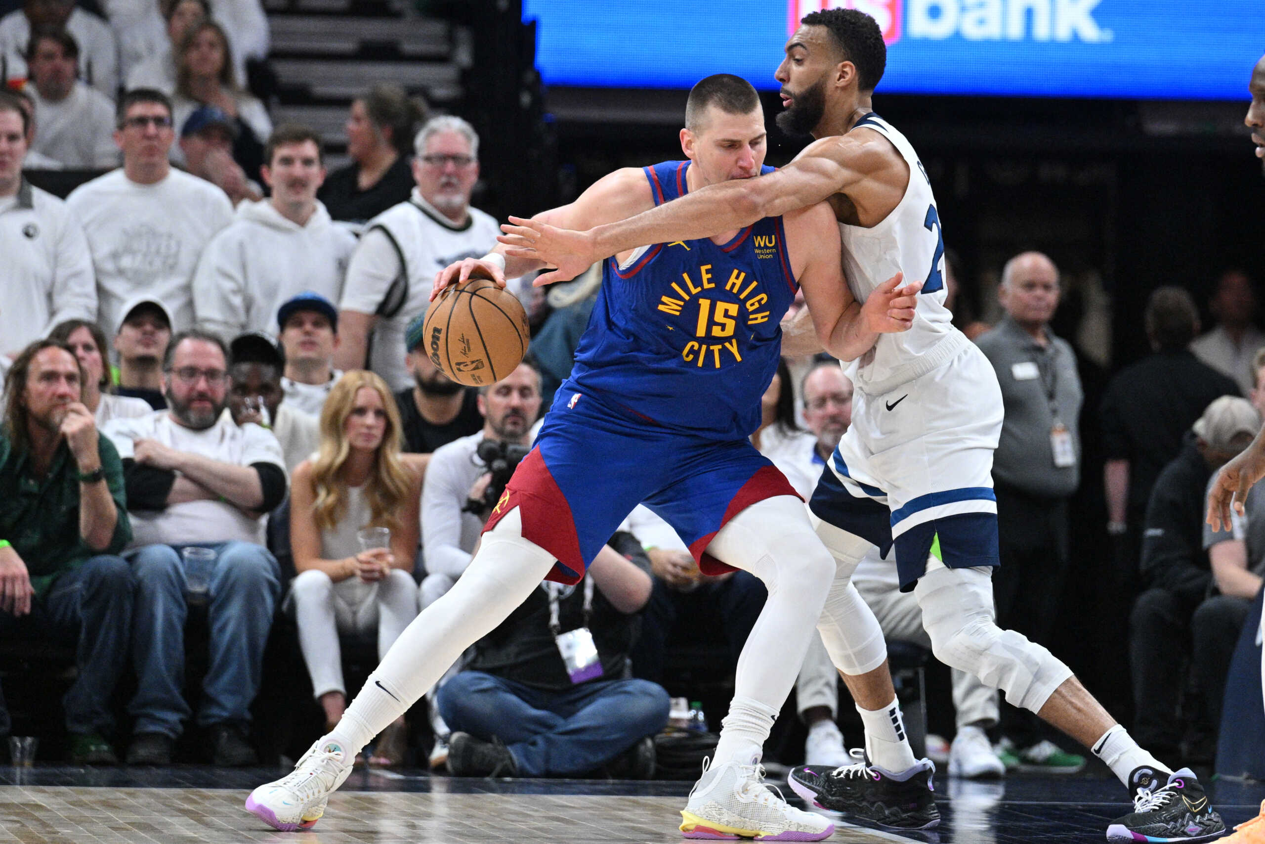 Apr 21, 2023; Minneapolis, Minnesota, USA; Denver Nuggets center Nikola Jokic (15) is defended by Minnesota Timberwolves center Rudy Gobert (27) during the fourth quarter of game three of the 2023 NBA Playoffs at Target Center. Mandatory Credit: Jeffrey Becker-USA TODAY Sports