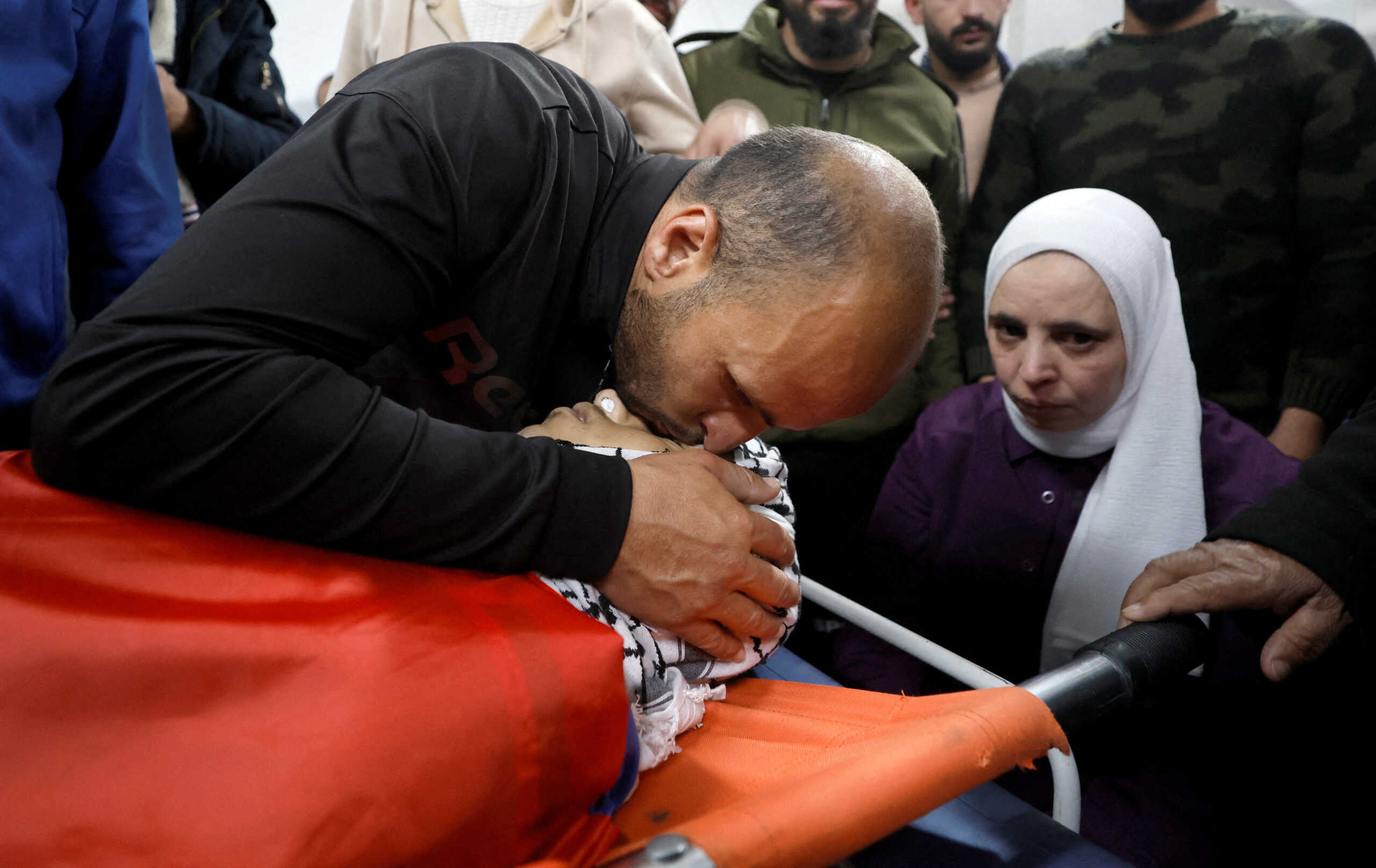 SENSITIVE MATERIAL. THIS IMAGE MAY OFFEND OR DISTURB    Mourners react next to the body of 16-year Mustafa Sabbah, who was killed in clashes with Israeli troops, in a hospital in Bethlehem in the Israeli-occupied West Bank April 28, 2023. REUTERS