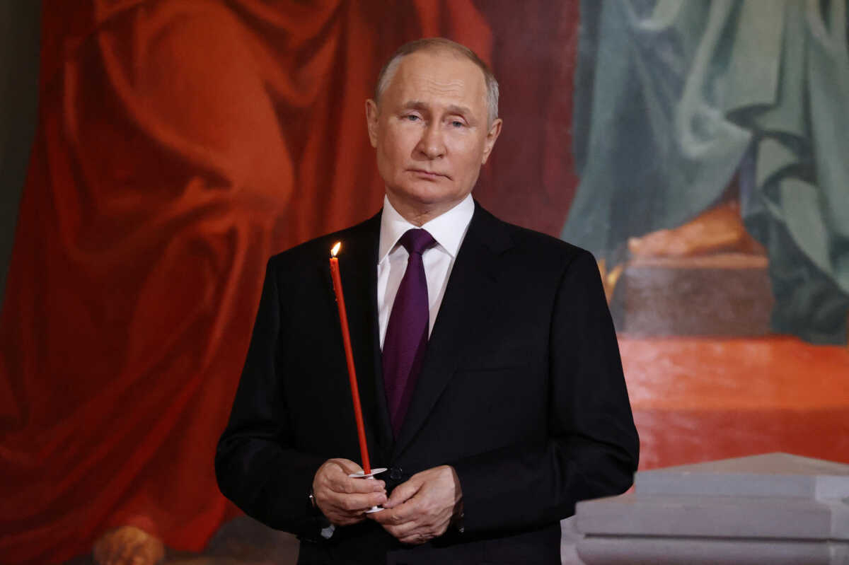 Russian President Vladimir Putin attends the Orthodox Easter service at the Cathedral of Christ the Saviour in Moscow, Russia, in this picture released April 16, 2023. Sputnik