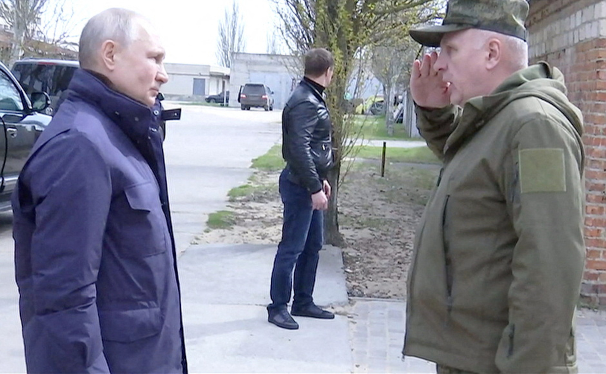 Russian President Vladimir Putin listens to Colonel General Oleg Makarevich, commander of the Dnieper Group of Forces, during his visit to the headquarters of the "Dnieper" army group in the Kherson Region, Russian-controlled Ukraine, in this still image taken from handout video released on April 18, 2023. Kremlin.ru