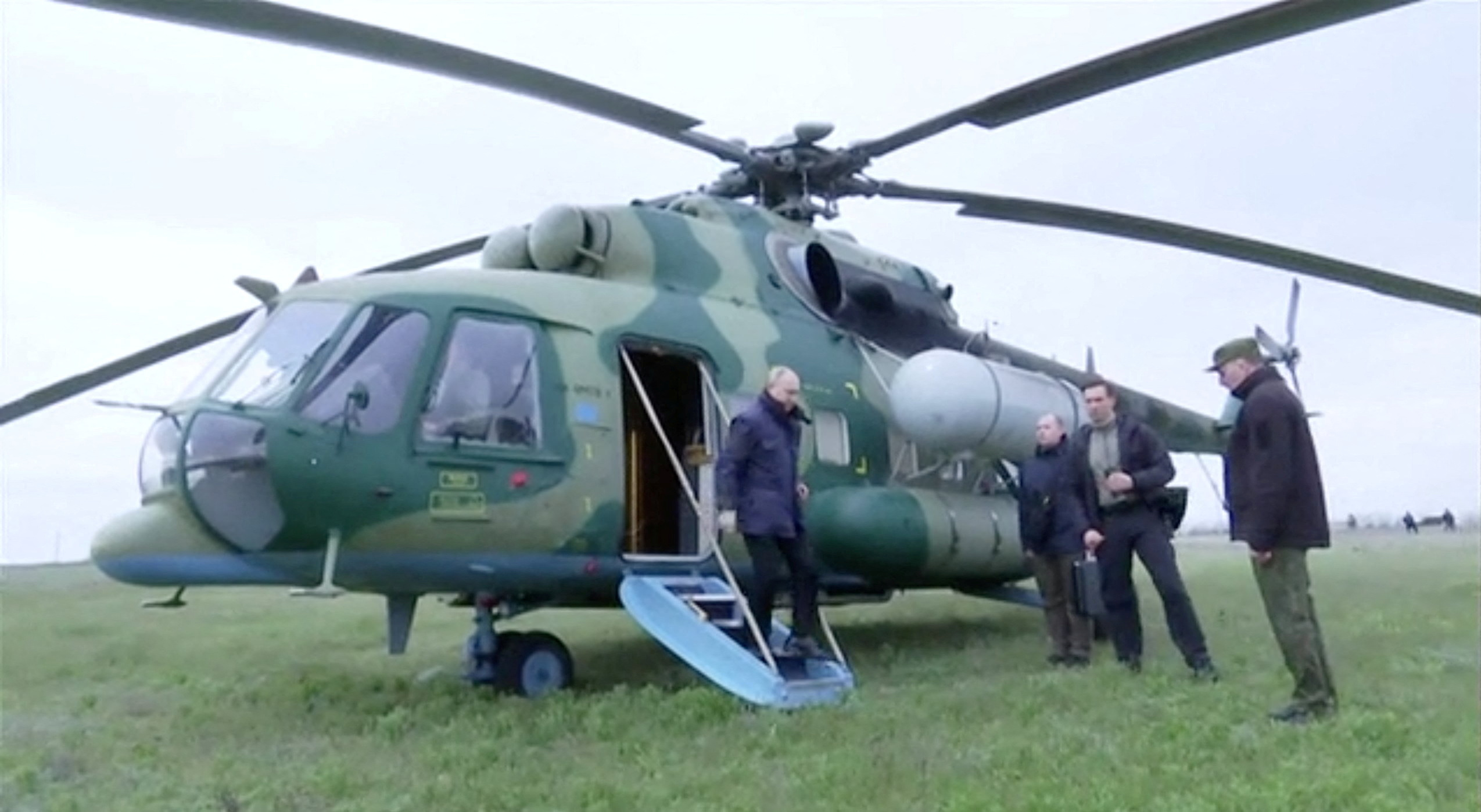 Russian President Vladimir Putin disembarks a helicopter as he visits the headquarters of the "Dnieper" army group in the Kherson Region, Russian-controlled Ukraine, in this still image taken from handout video released on April 18, 2023. Kremlin.ru
