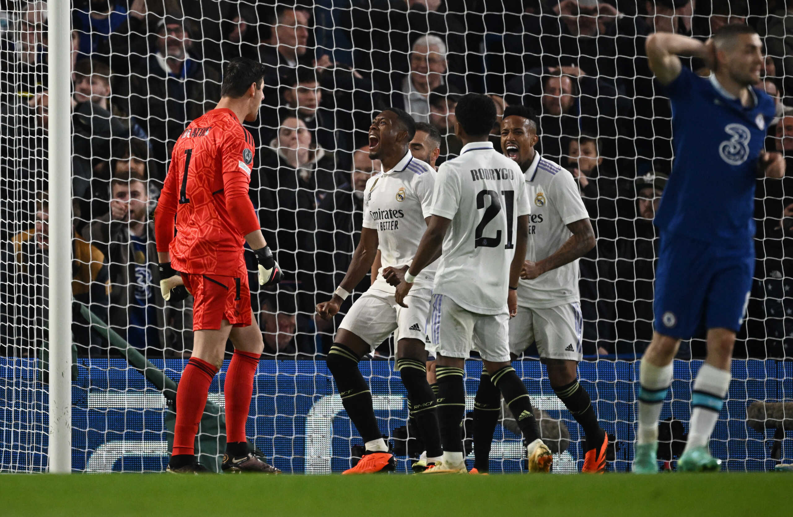 Soccer Football - Champions League - Quarter Final - Second Leg - Chelsea v Real Madrid - Stamford Bridge, London, Britain - April 18, 2023 Real Madrid players celebrate with Thibaut Courtois after he saves a shot from Chelsea's Marc Cucurella REUTERS