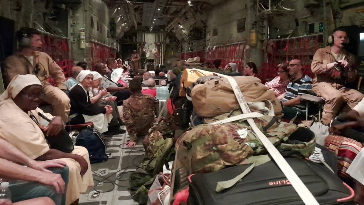 Italian citizens are boarded on an Italian Air Force C130 aircraft during their evacuation from Khartoum, Sudan, in this undated photo obtained by Reuters on April 24, 2023. Ministero della Difesa