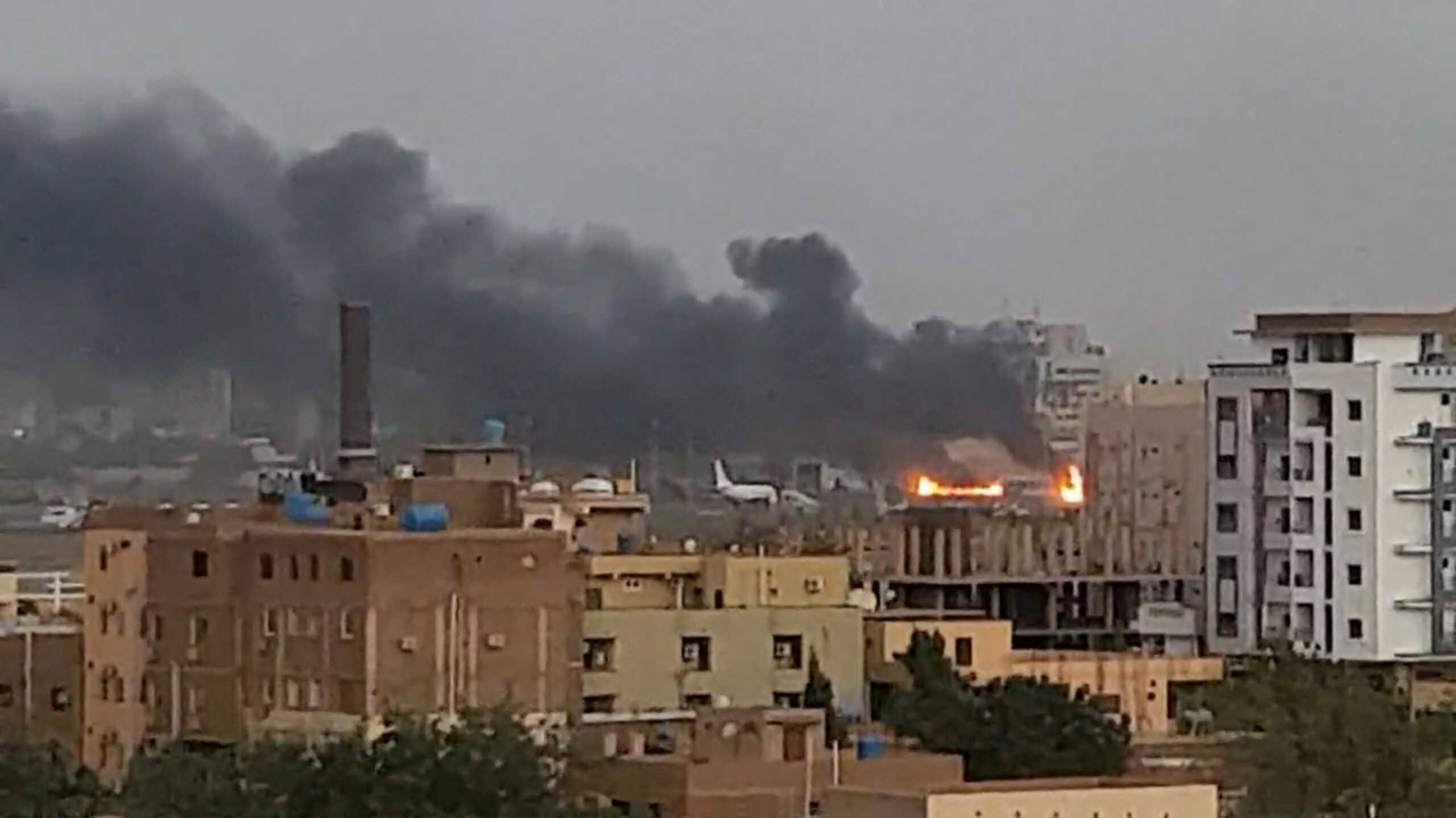 Smoke rises from the tarmac of Khartoum International Airport as a fire burns, in Khartoum, Sudan April 17, 2023 in this screen grab obtained from a social media video. Abdullah Abdel Moneim
