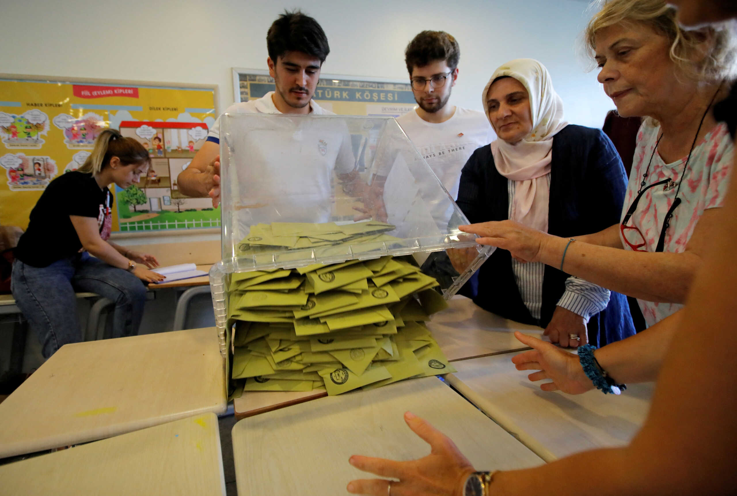 FILE PHOTO: Election officials open a ballot box to count votes at a polling station in Istanbul, Turkey, June 23, 2019. REUTERS