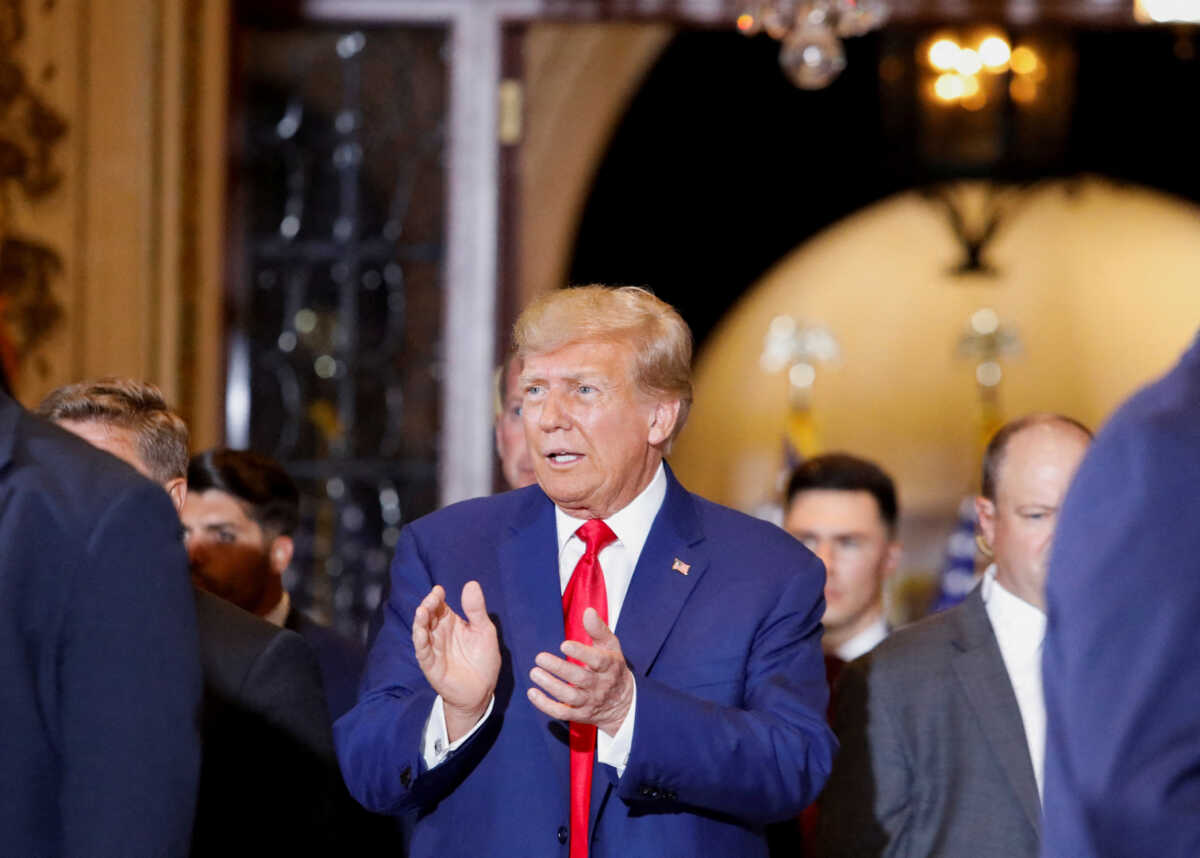 Former U.S. President Donald Trump walks, ahead of delivering remarks on the day of his court appearance in New York after being indicted by a Manhattan grand jury following a probe into hush money paid to porn star Stormy Daniels, in Palm Beach, Florida, U.S., April 4, 2023. REUTERS