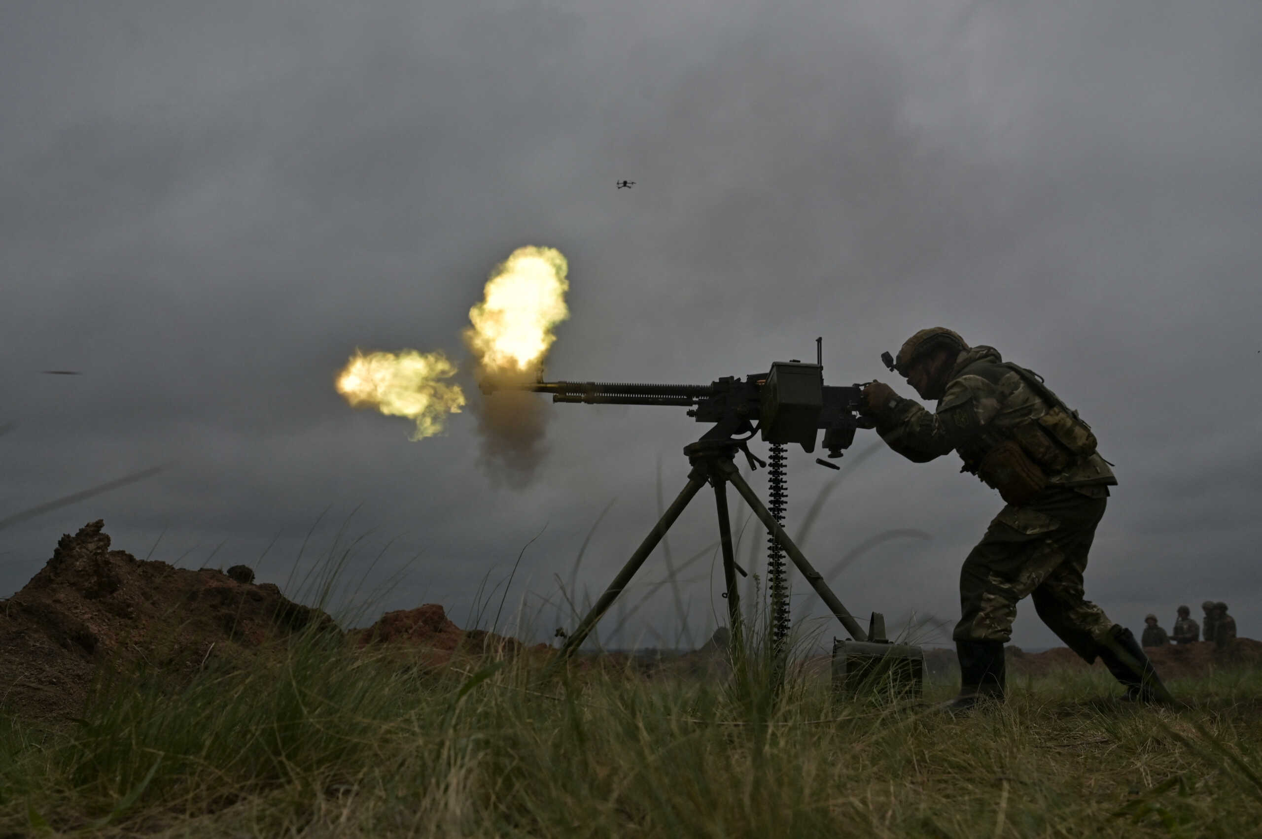 A Ukrainian service member fires a DShK machine gun during military drills at a training ground, amid Russia's attack on Ukraine, in Zaporizhzhia region, Ukraine April 28, 2023. REUTERS