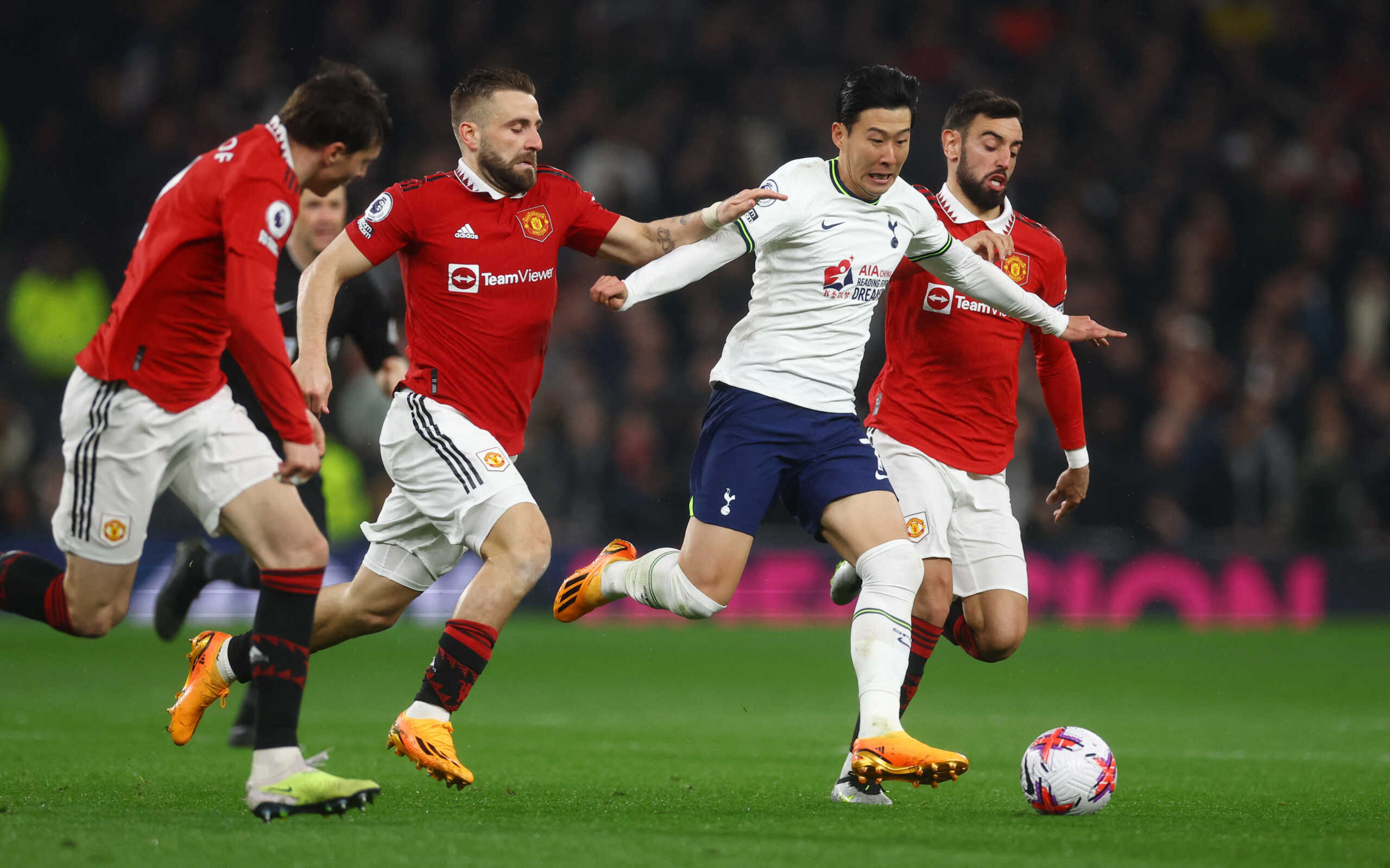 Soccer Football - Premier League - Tottenham Hotspur v Manchester United - Tottenham Hotspur Stadium, London, Britain - April 27, 2023 Manchester United's Luke Shaw and Bruno Fernandes in action with Tottenham Hotspur's Son Heung-min Action Images via Reuters