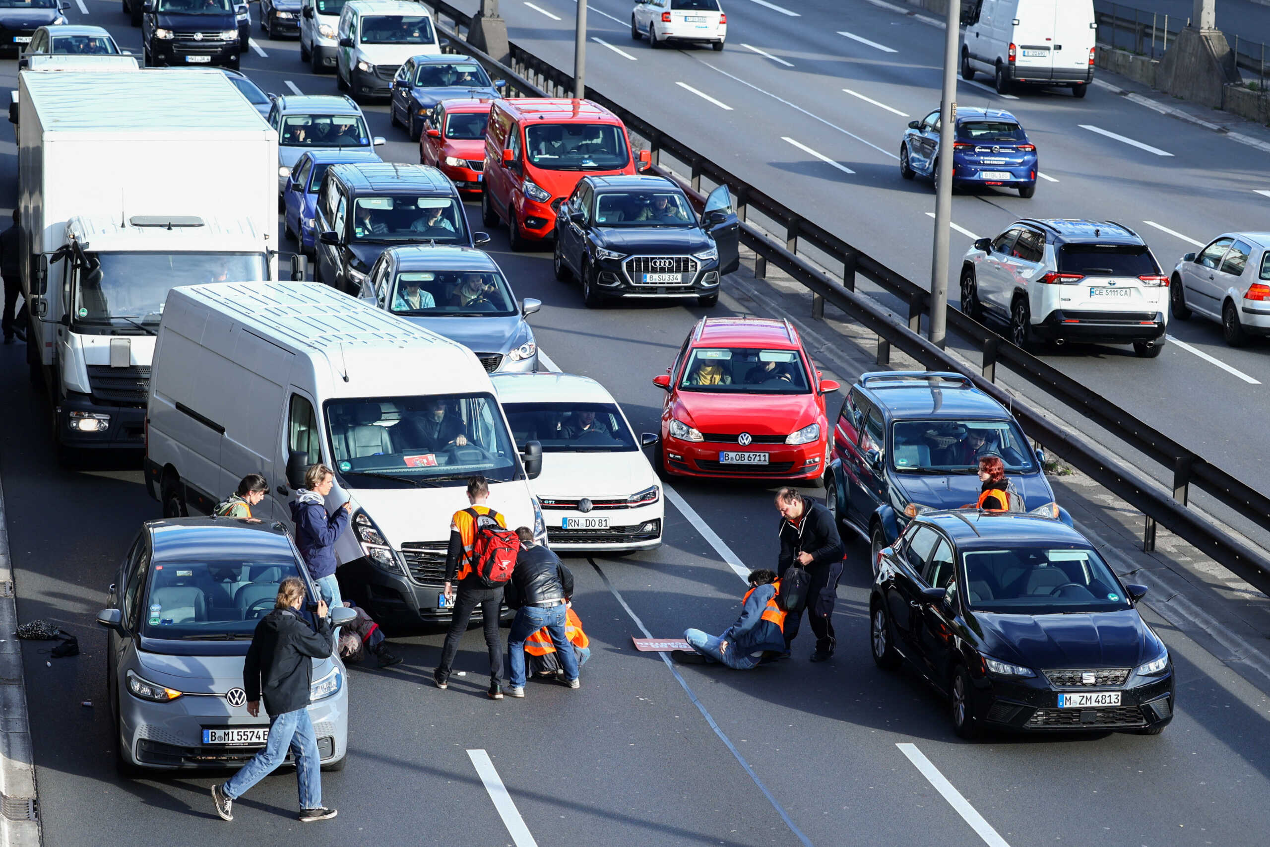 An ambulance is stuck in traffic jam as activists of the "Letzte Generation" (Last Generation) block a highway to protest for climate councils, speed limit on highways as well as for affordable public transport, in Berlin, Germany, April 24, 2023. REUTERS