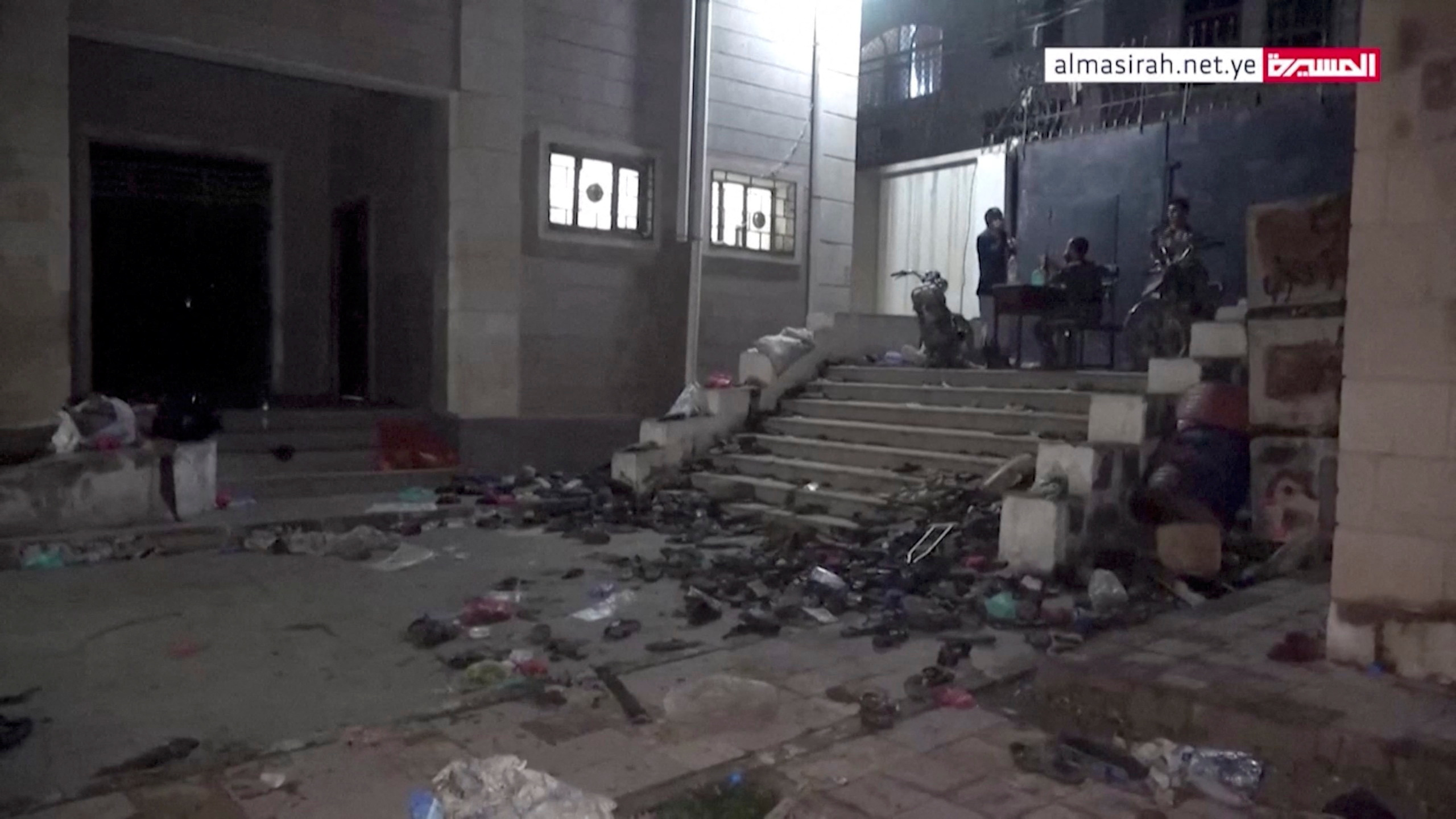 Abandoned footwear and other belongings lie on the ground after a stampede in Sanaa, Yemen, April 19, 2023, in this still image taken from video.  Al Masirah TV